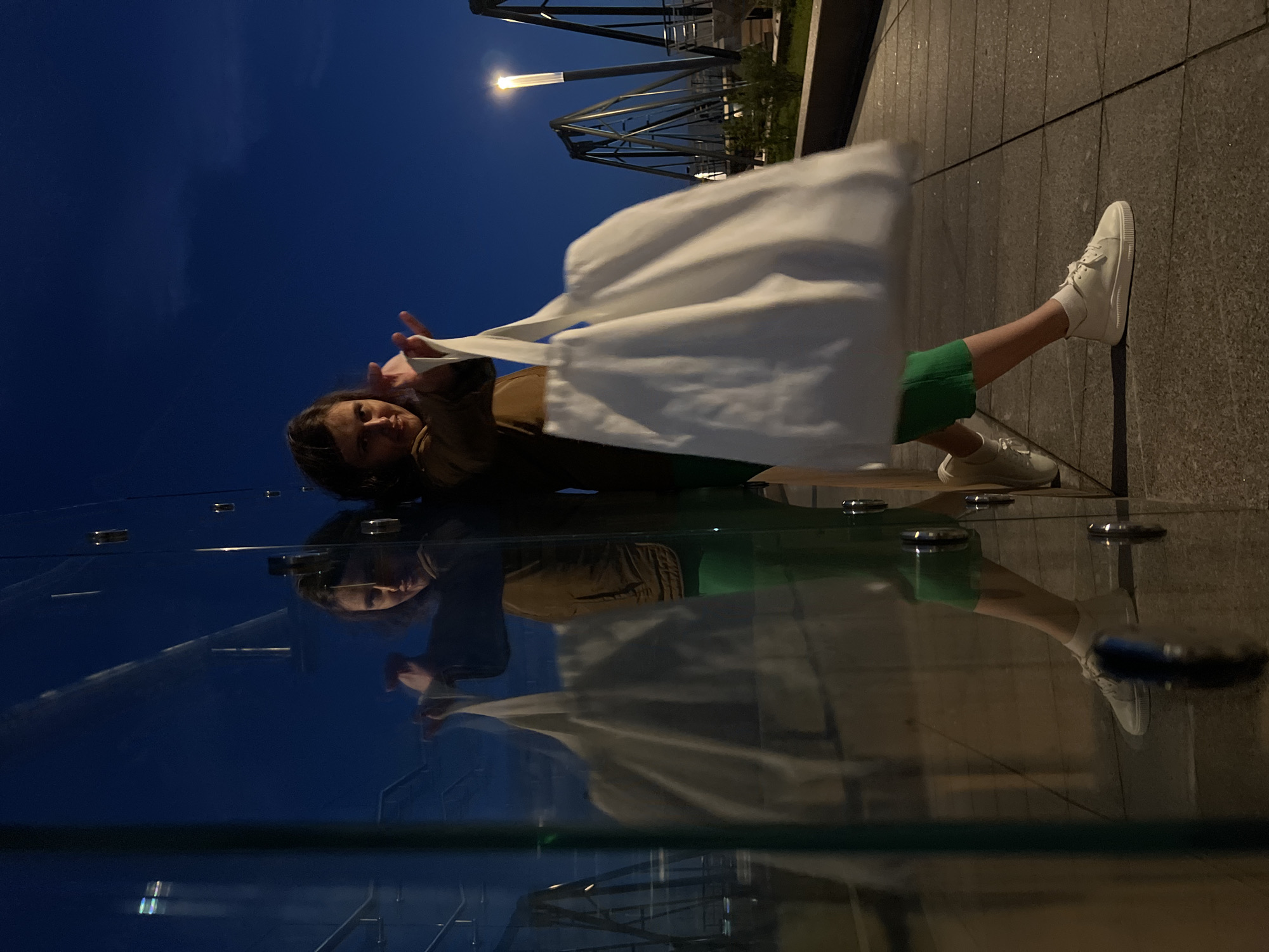 Saint Petersburg at dusk: glass towers and a glowing island chapel