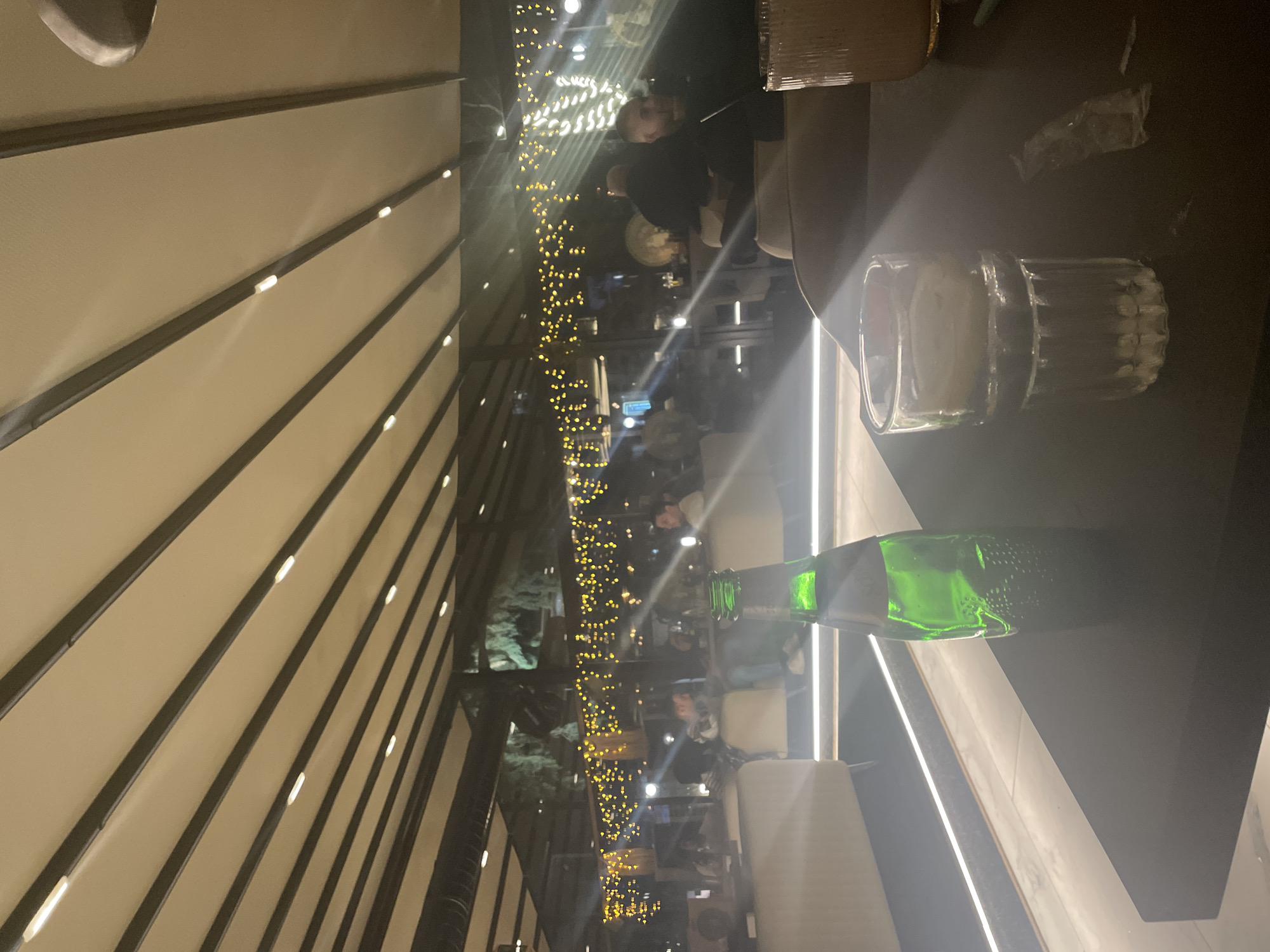 Evening crowd gathers at lit cafe in Stara Zagora
