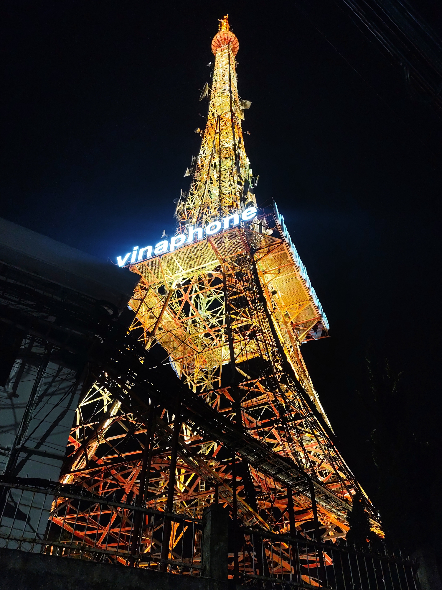 Nighttime gatherings documented around Da Lat's illuminated Vinaphone tower