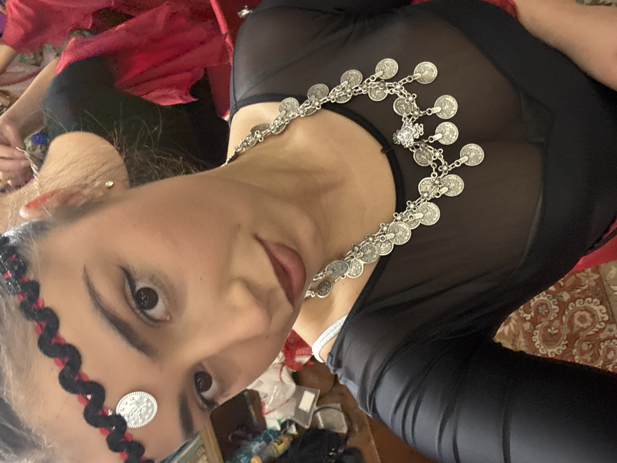 Woman in traditional coin jewelry observed at location