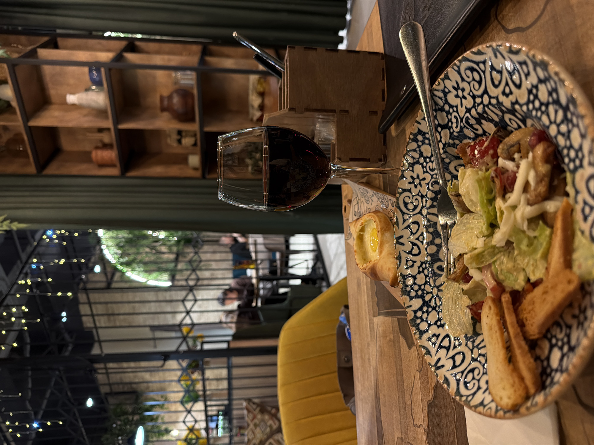 Restaurant table setting documented with salad meal