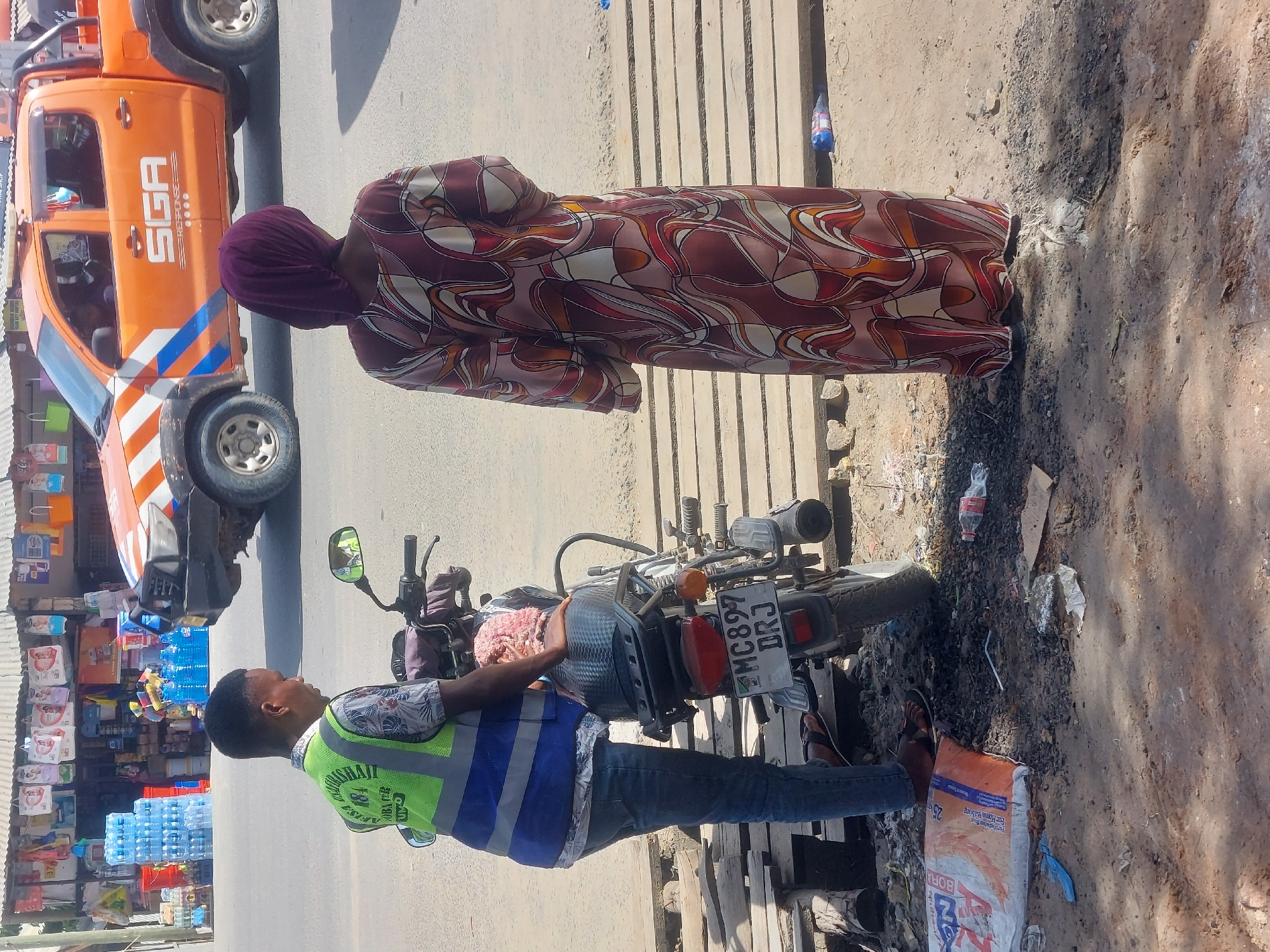 Street food vendors serve customers across Dar es-Salaam