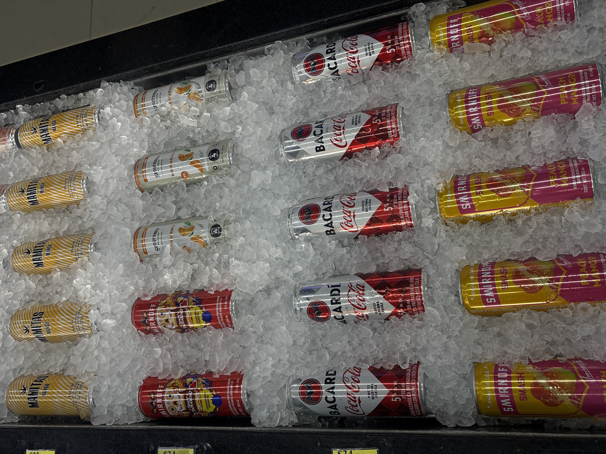 Alcoholic beverages displayed on ice in San Buenaventura store
