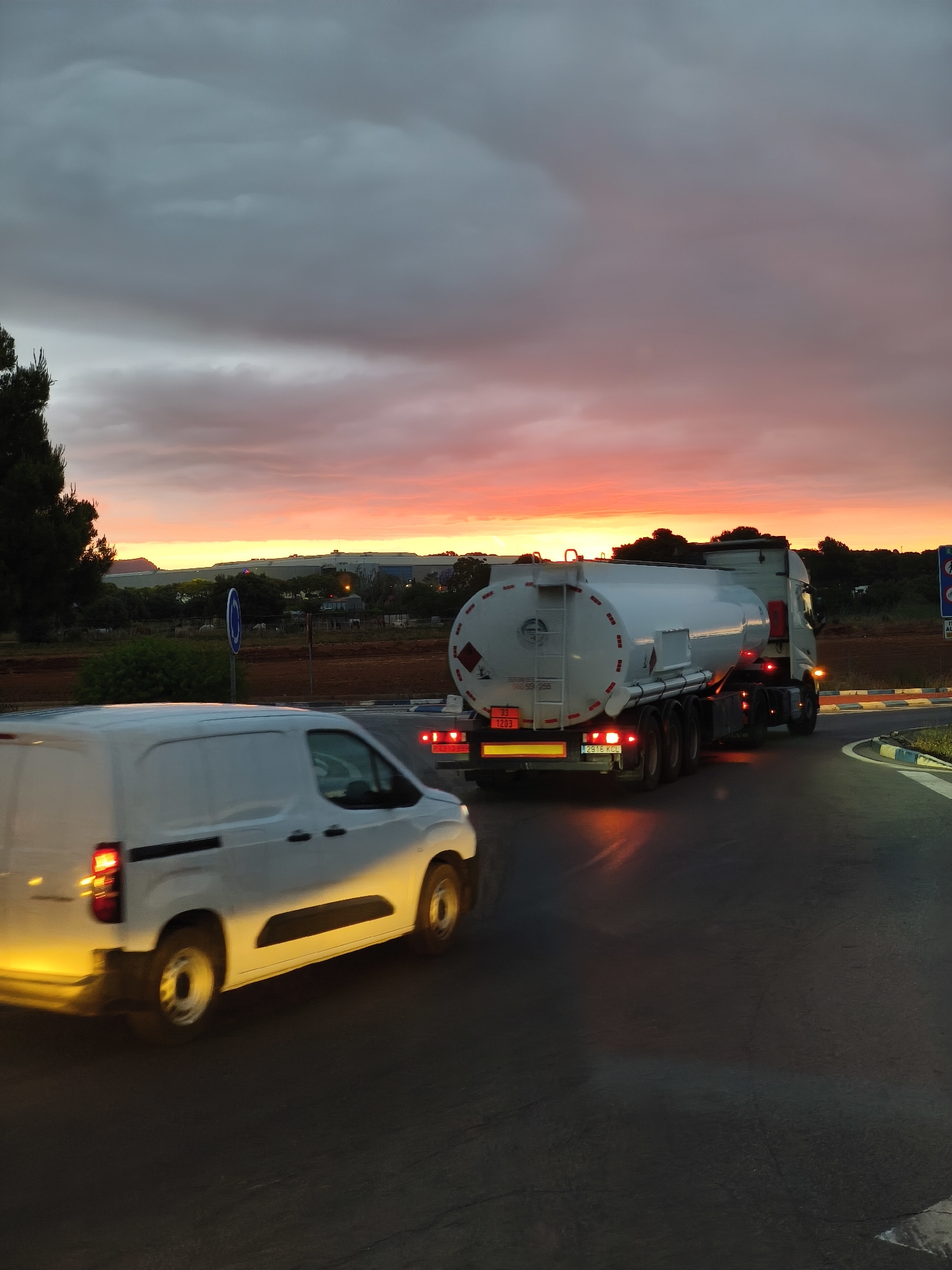 Dramatic sunset captured over highway in Museros, Spain