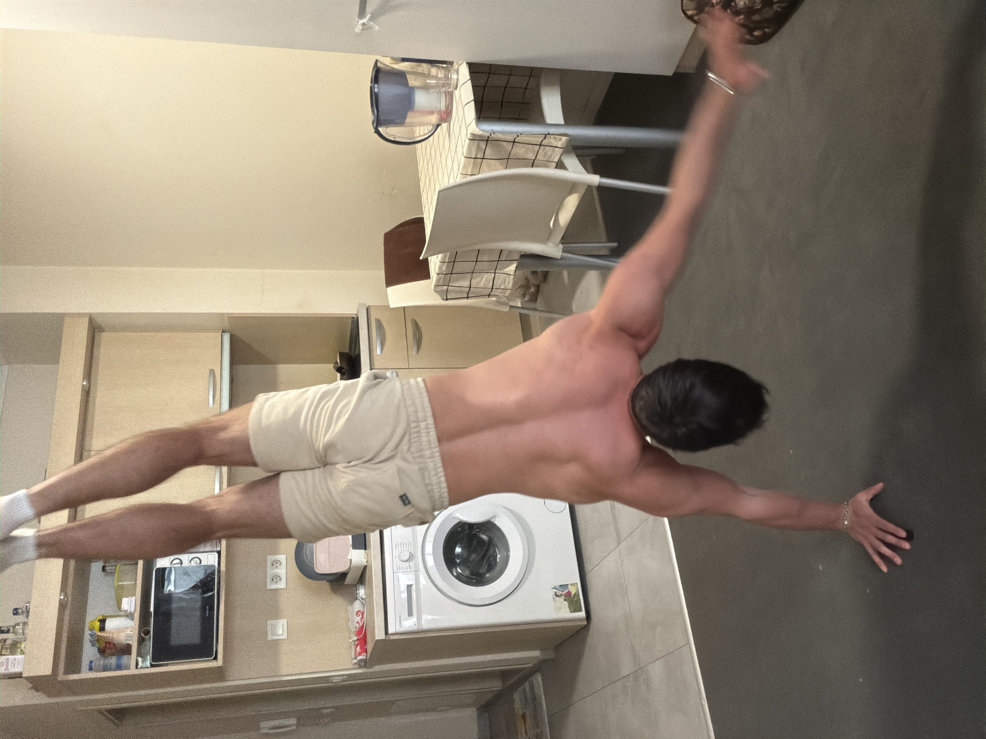 Man performs indoor calisthenics workout in Sofia breakroom