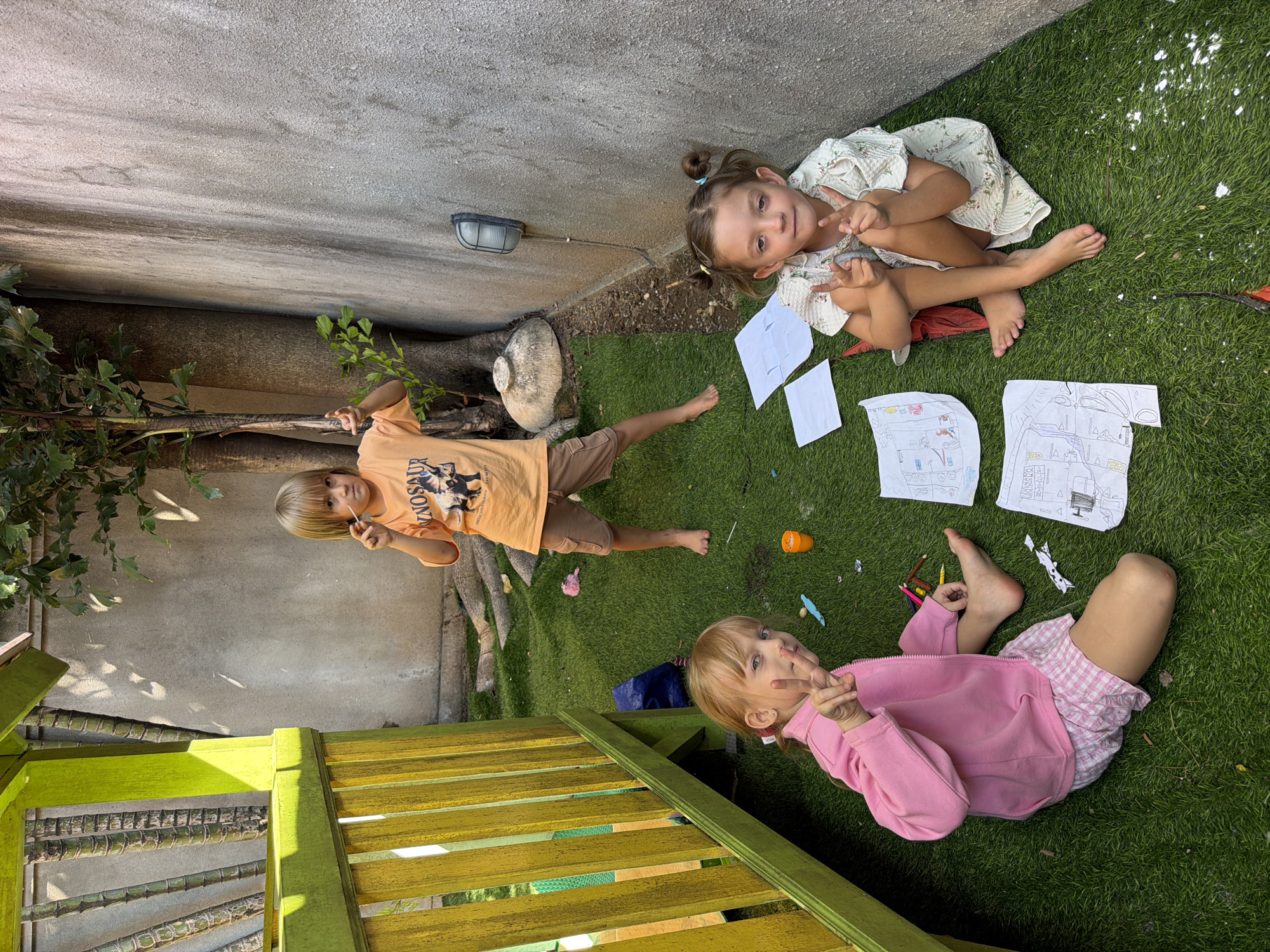 Kids playing in a Kuta backyard on a June morning