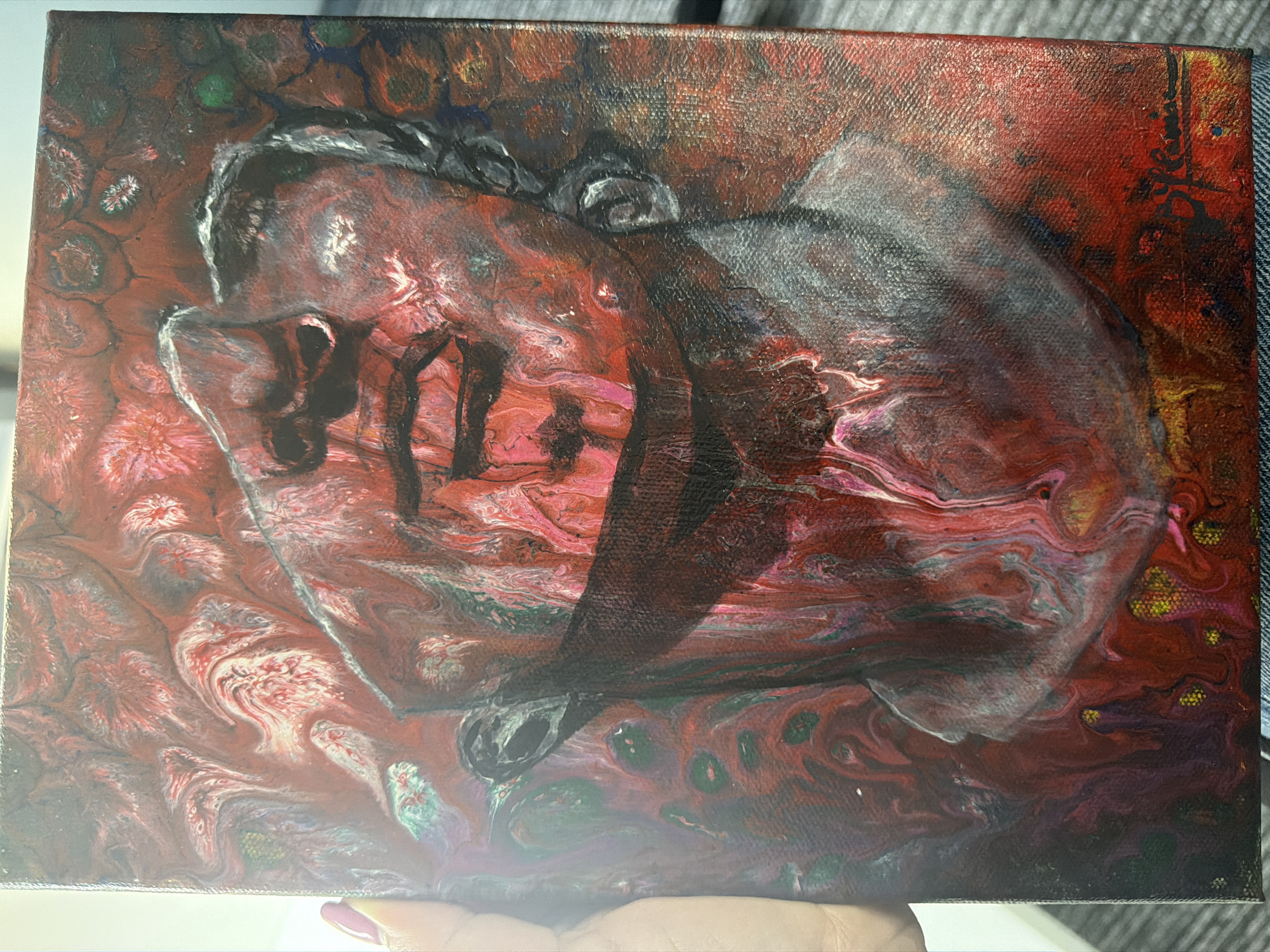 Portrait painting in red, white, black observed in London