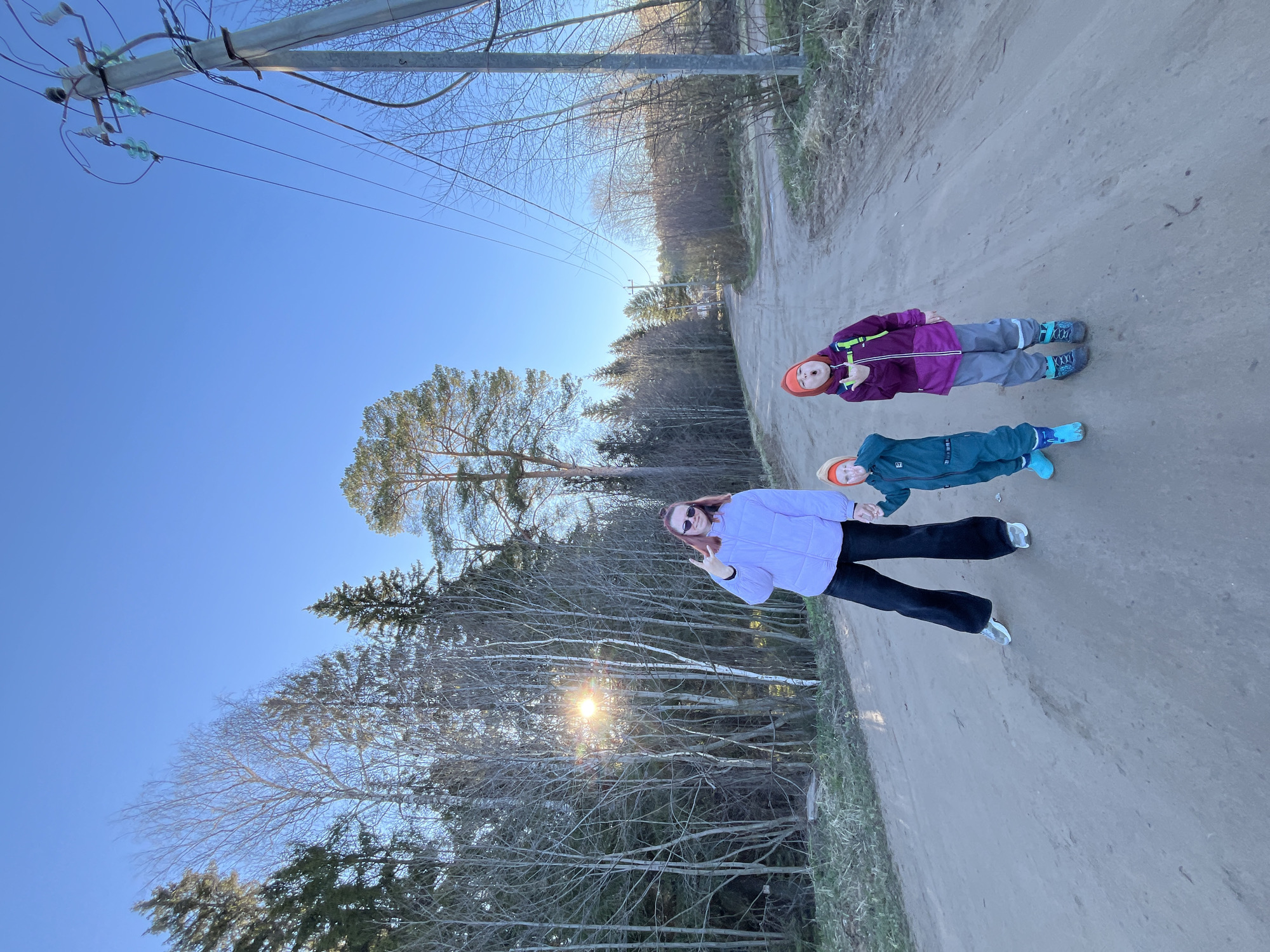 Family photographed on dirt road in Chaikovsky, Russia