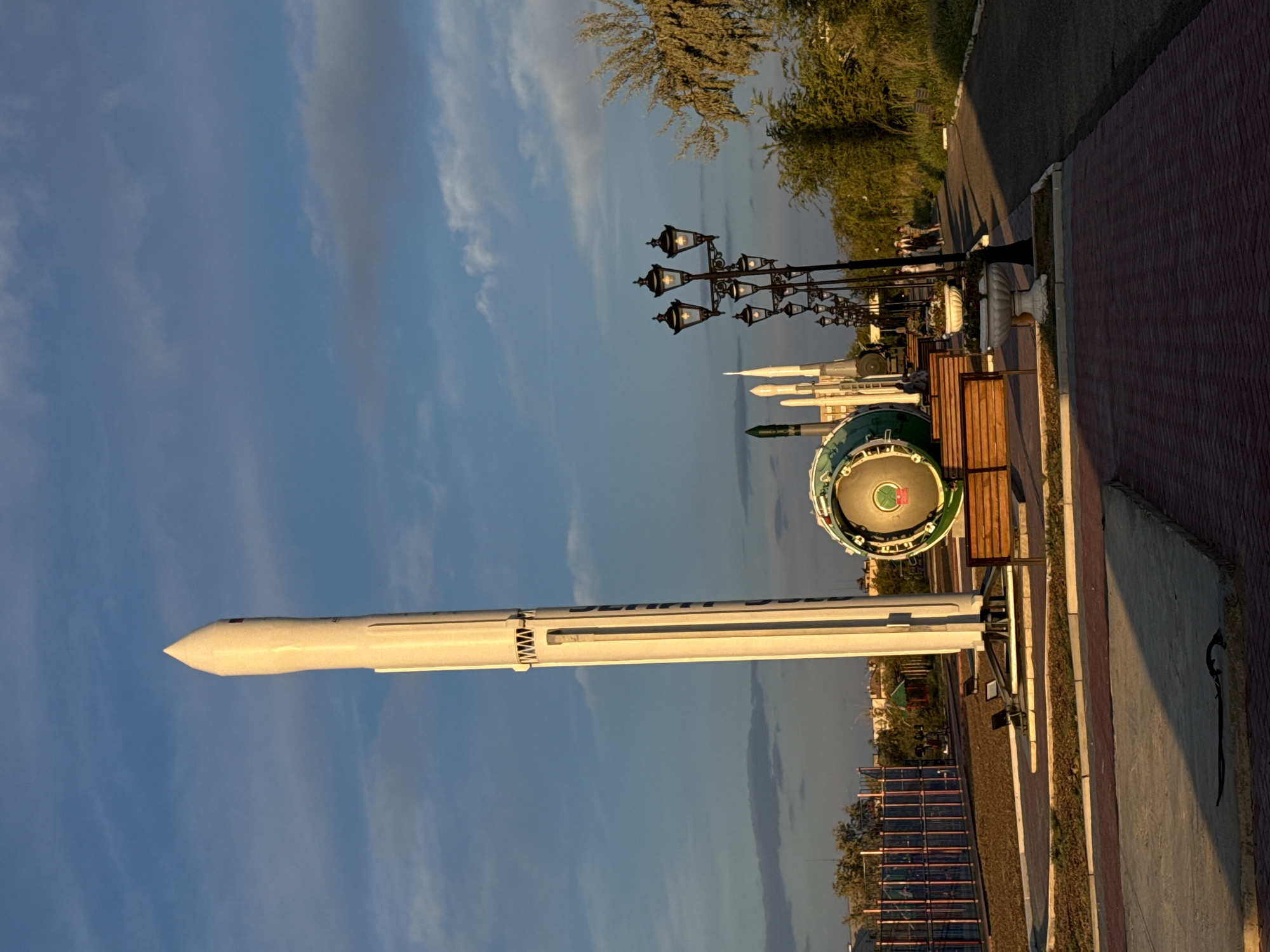 Baikonur's outdoor rocket monument park at golden hour