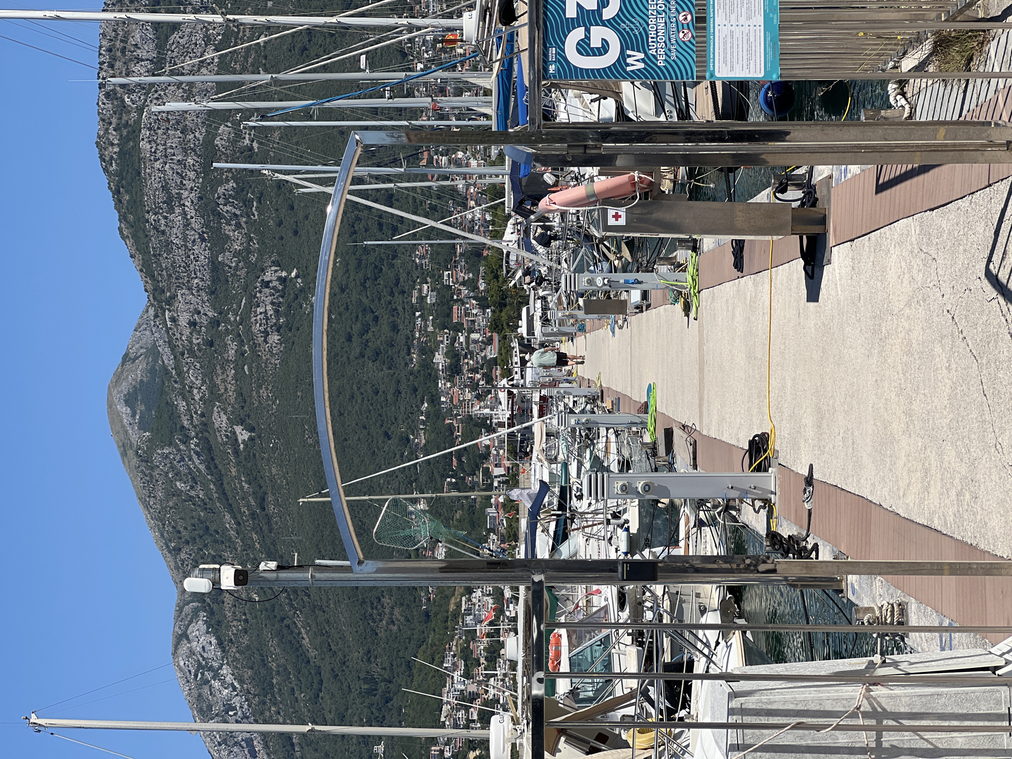 Colorful vehicles and boats at Bar Marina, Montenegro
