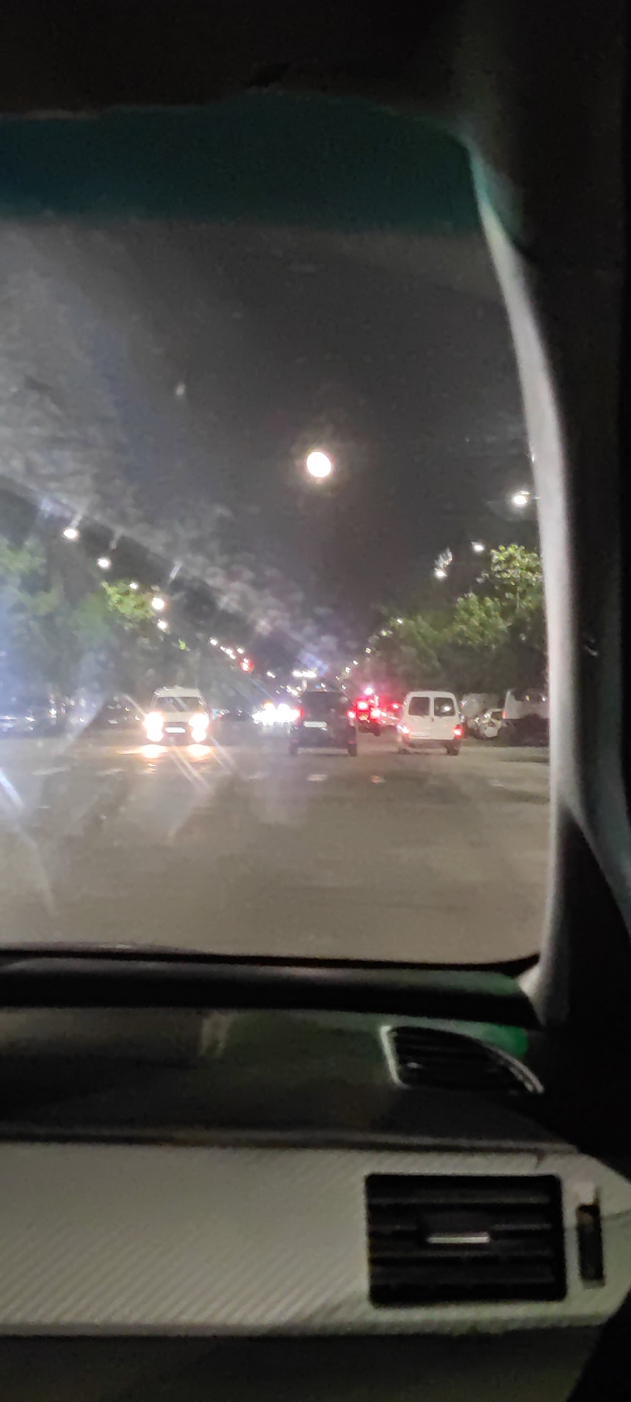 Nighttime street scene documented in Yerevan from vehicle