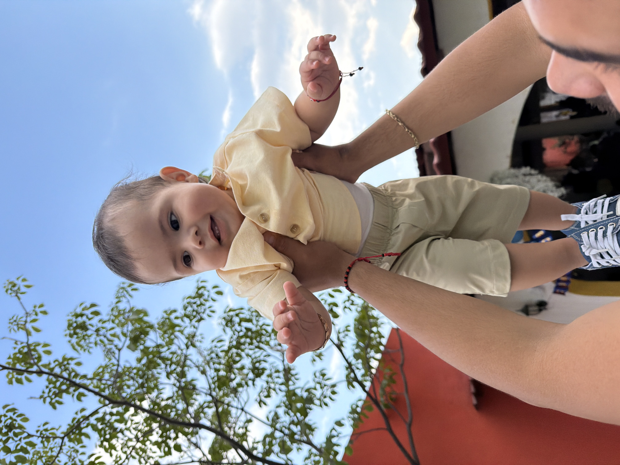 Baby held skyward captured in photograph in Cuautla, Mexico