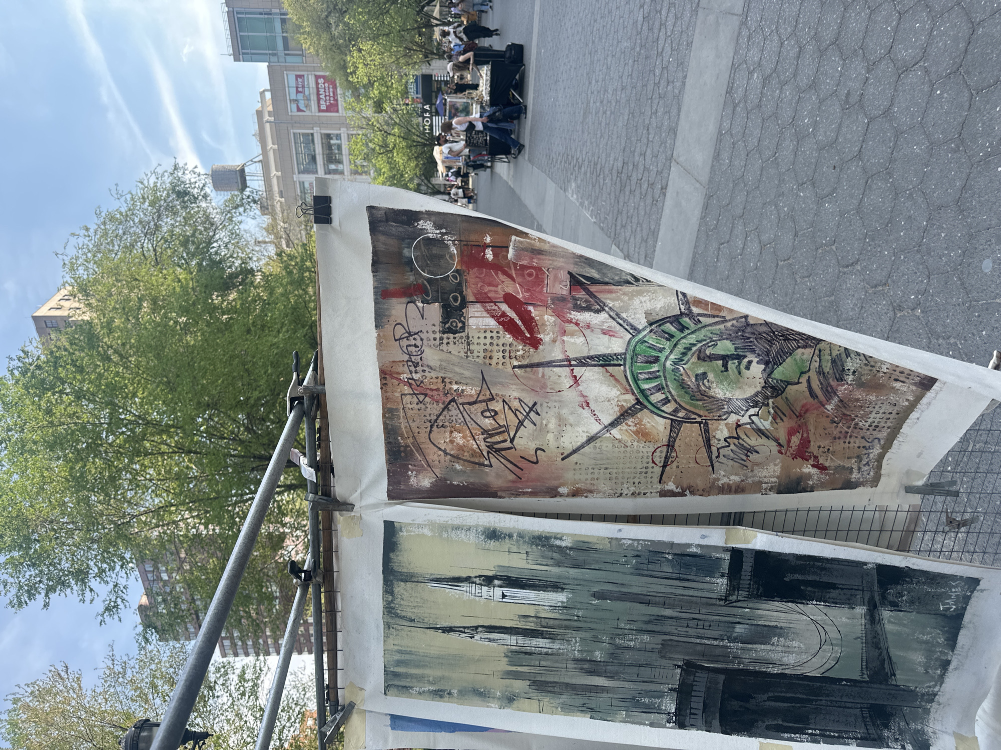 Street artist displays abstract paintings in NYC public square