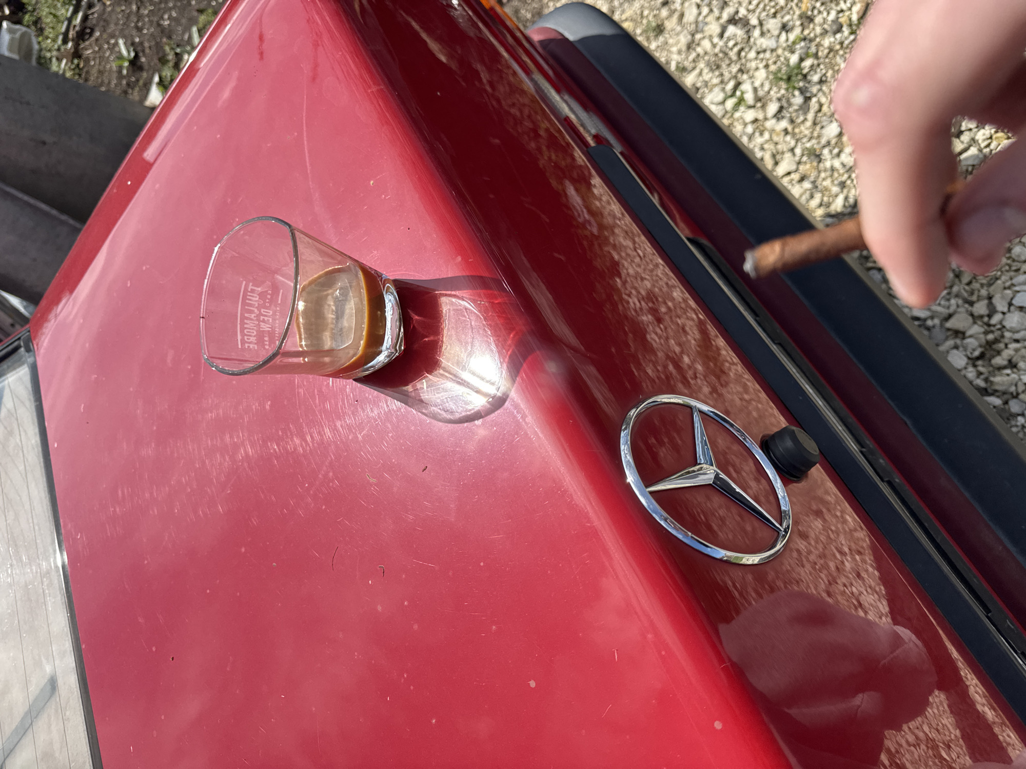 Coffee break by red Mercedes in Bulgarian village