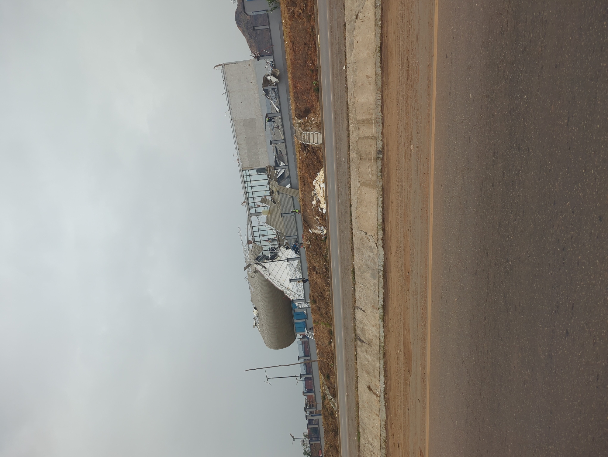 Building with storage tank and debris documented in Kugbo