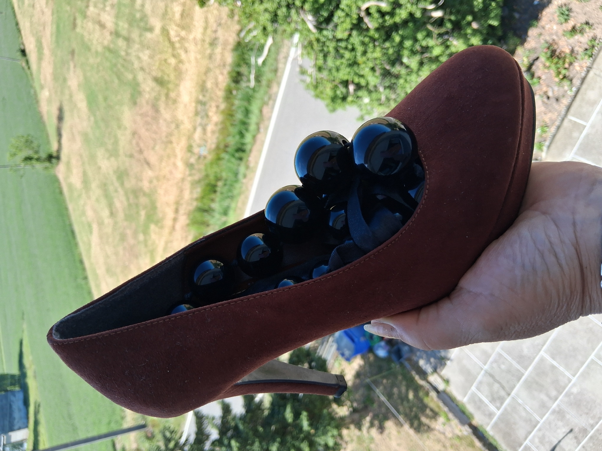 Artistic shoe installation documented in Colorno, Italy