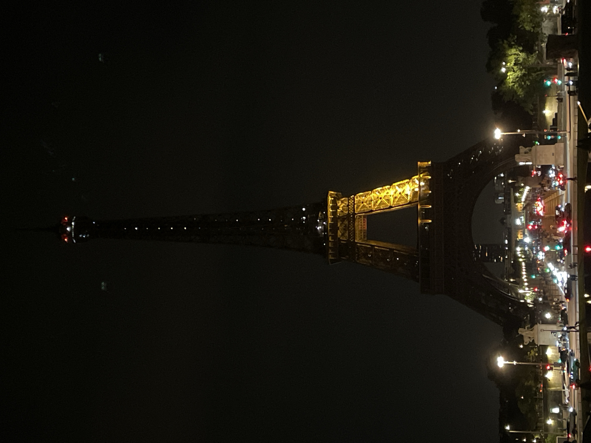 Eiffel Tower glows golden in Paris night scene