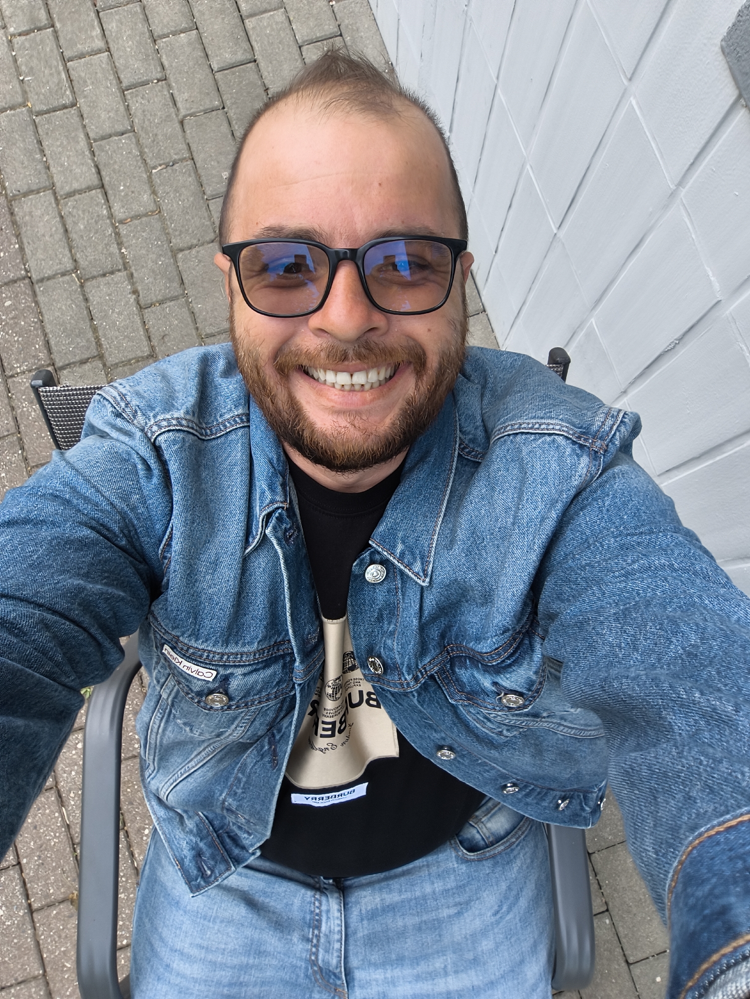 Man in denim jacket documented across multiple casual moments