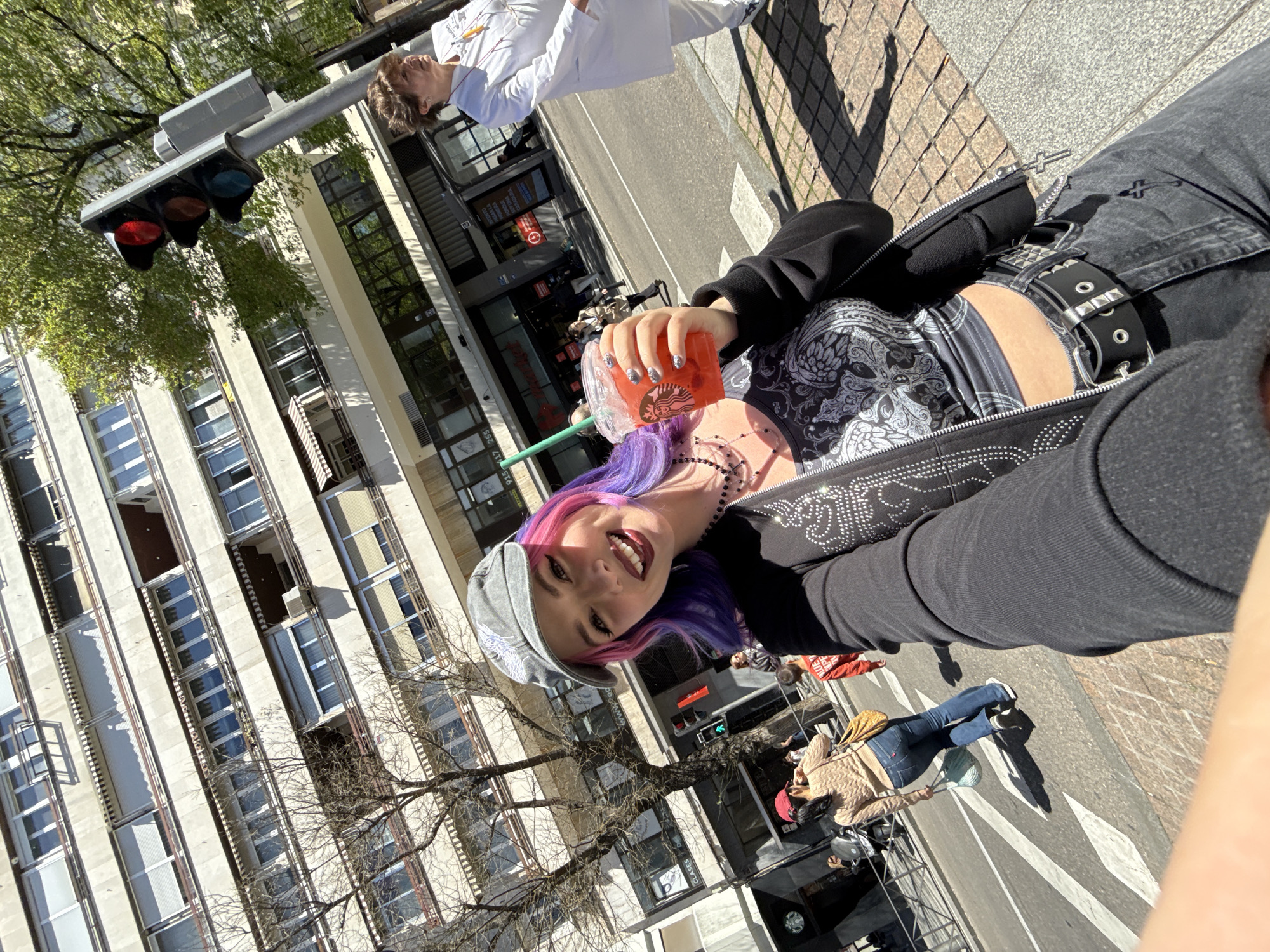 Woman with colorful hair takes selfies across Madrid locations