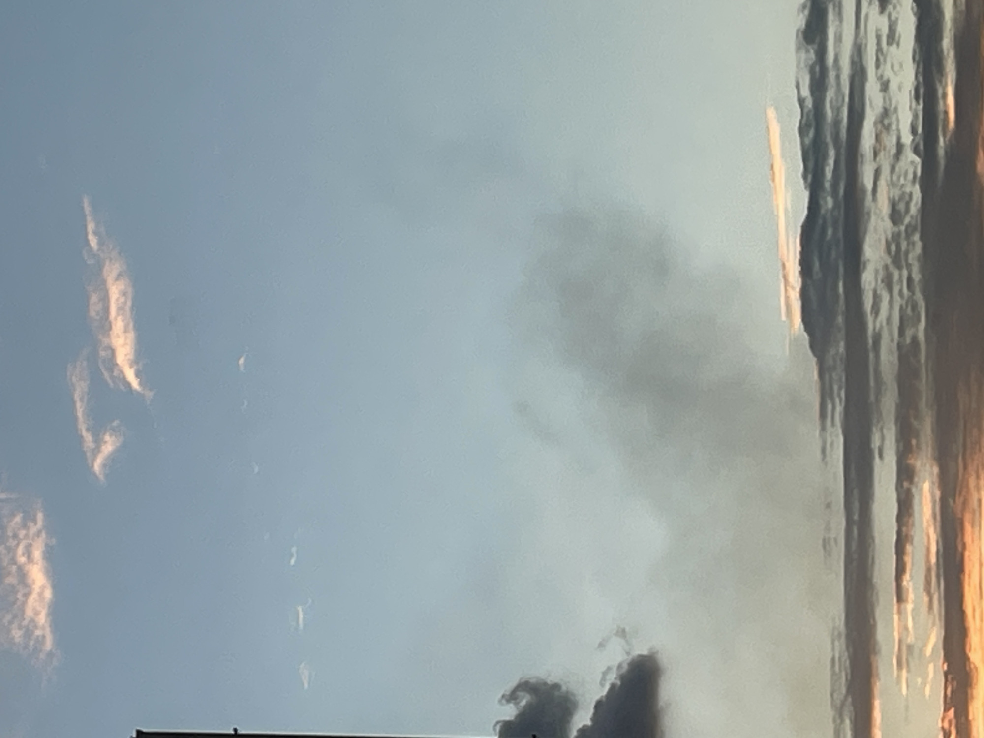 Omsk skies tracked through clouds, color shifts, and a smoke plume