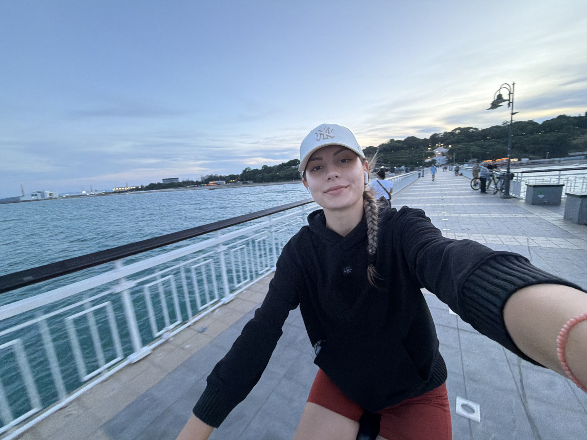 Young women cycle, photograph at Burgas Sea Garden Pier