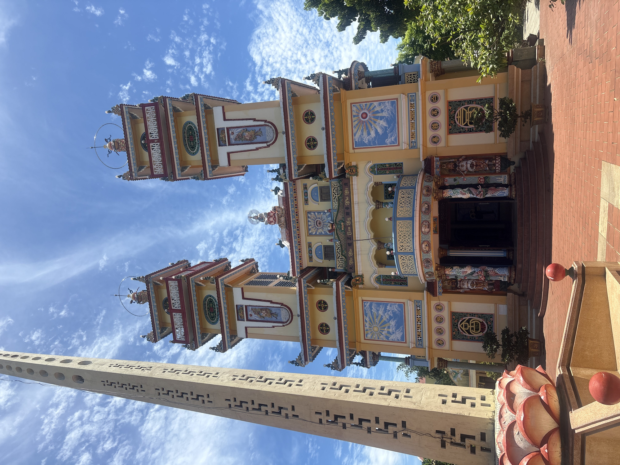 Tu Van Pagoda's colorful towers under clear Hoi An skies
