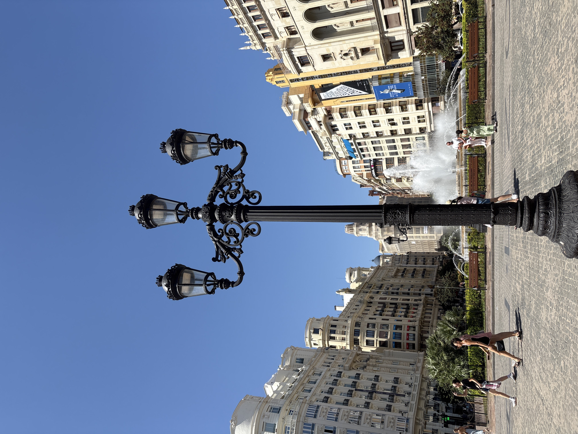 Sunny afternoon in a palm-lined València city square
