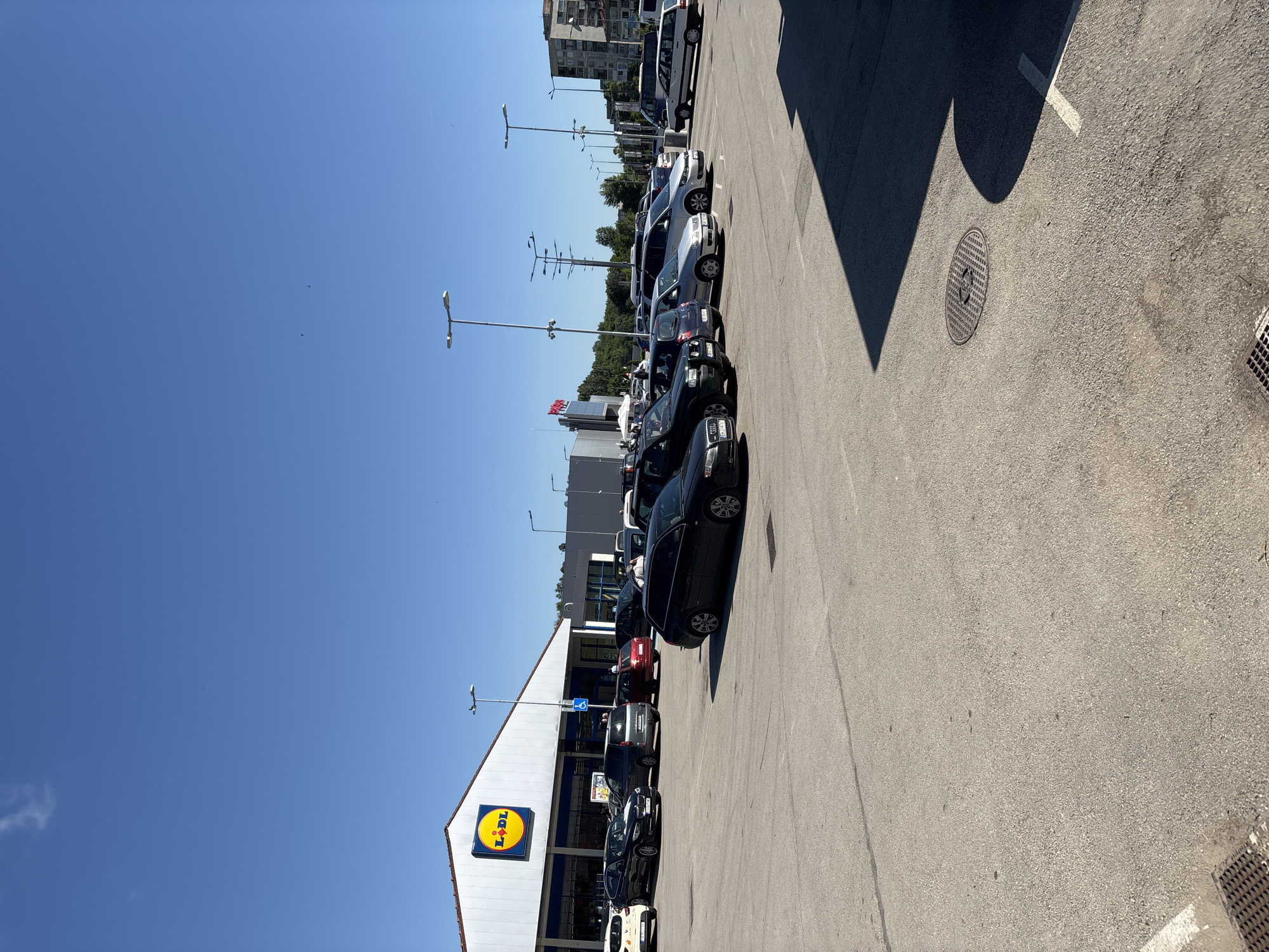 Busy Lidl store parking lot observed in Lovech, Bulgaria