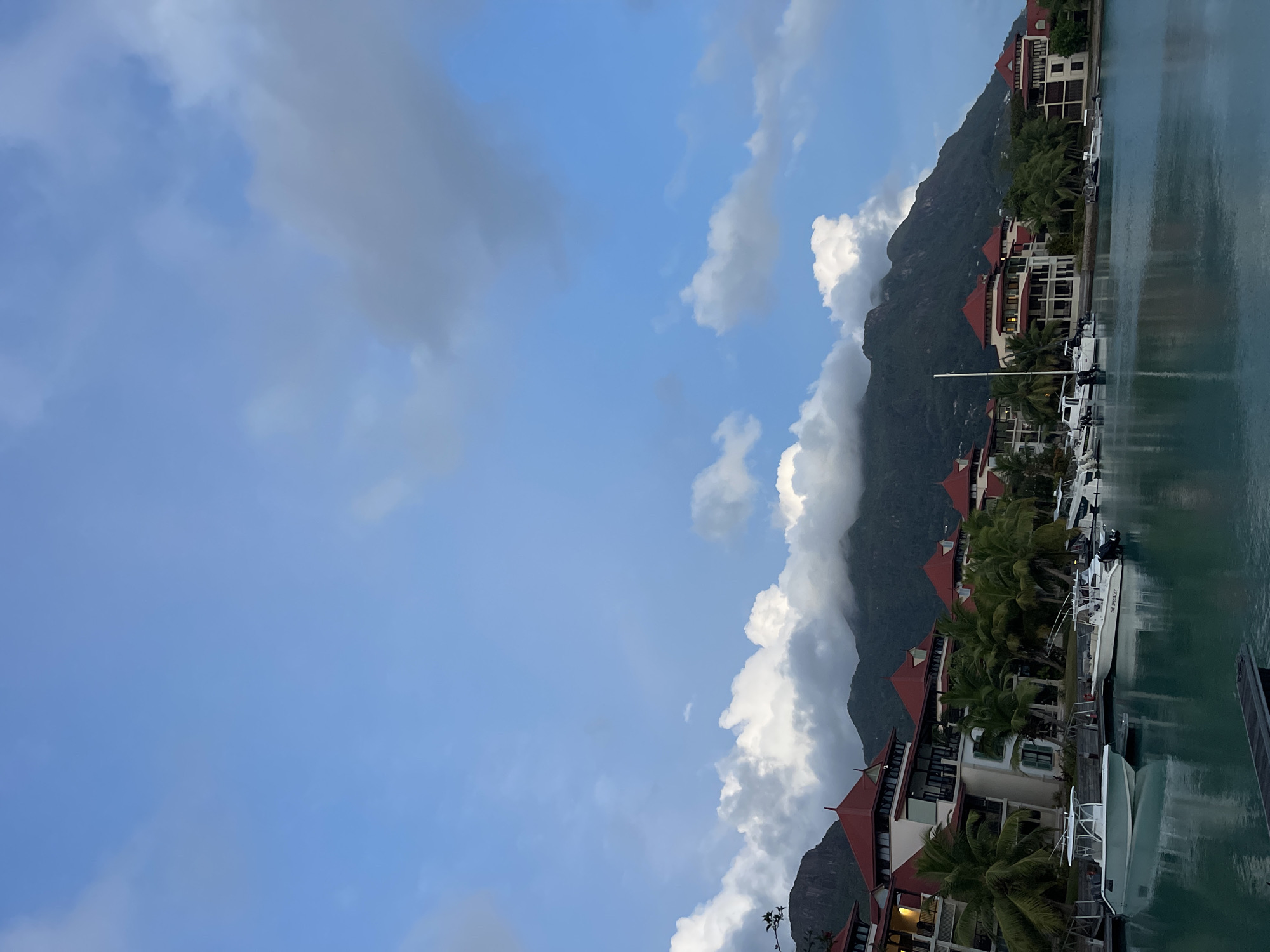 Dusk over Providence harbor, Seychelles, with boats and red rooftops