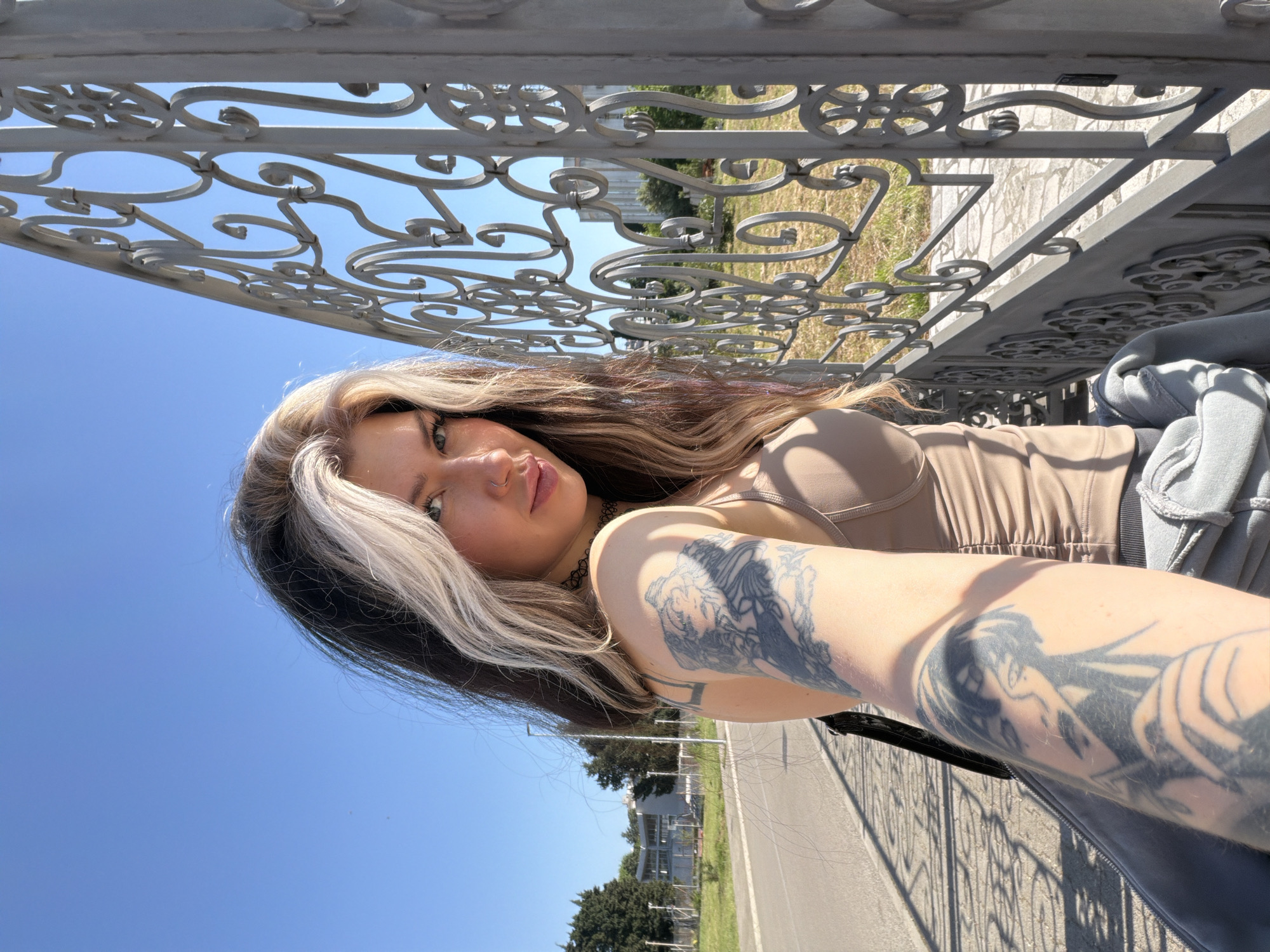 Woman photographs herself near Orthodox church in Šušanj, Montenegro