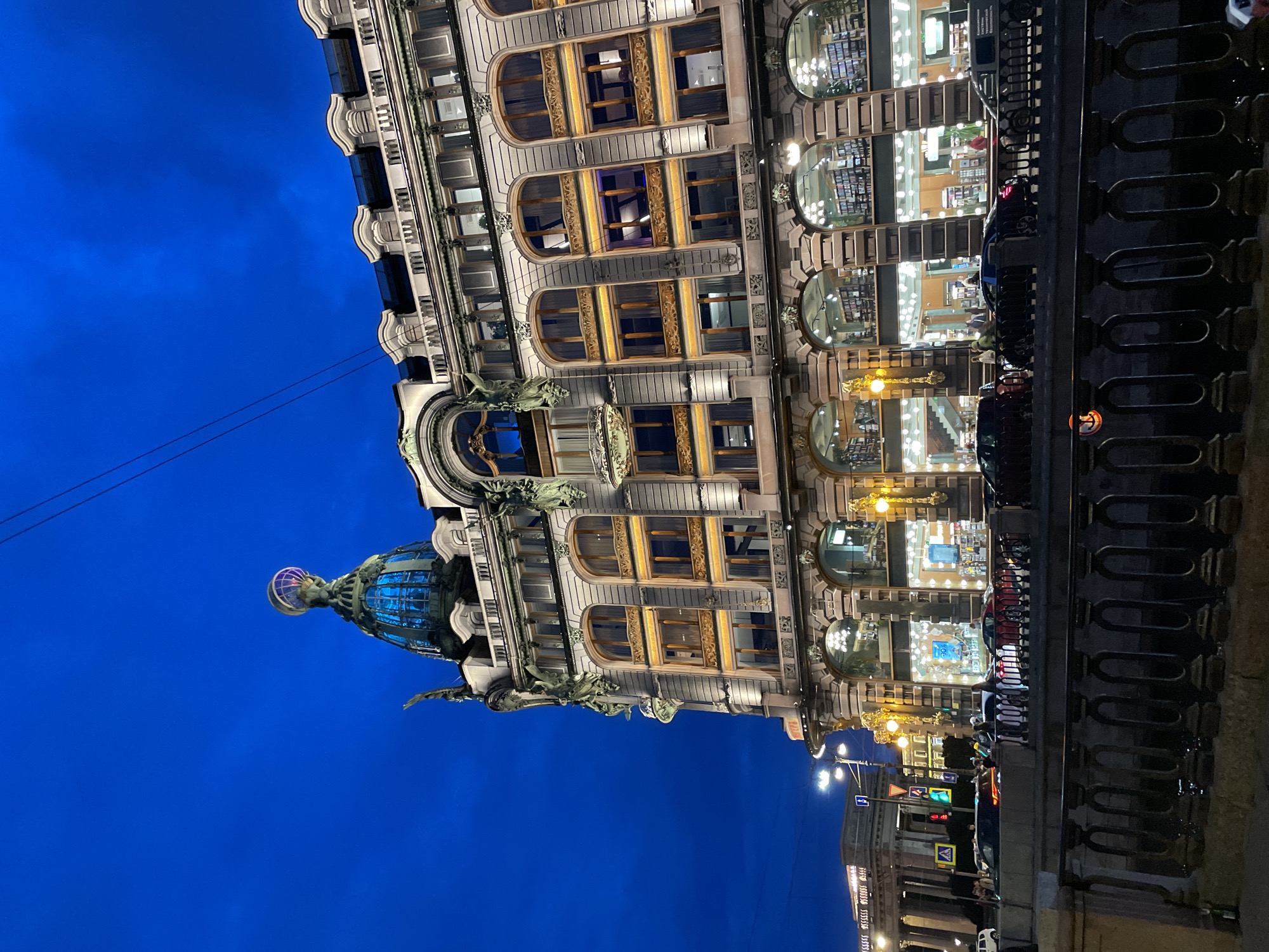 Ornate Russian building glowing against a twilight sky