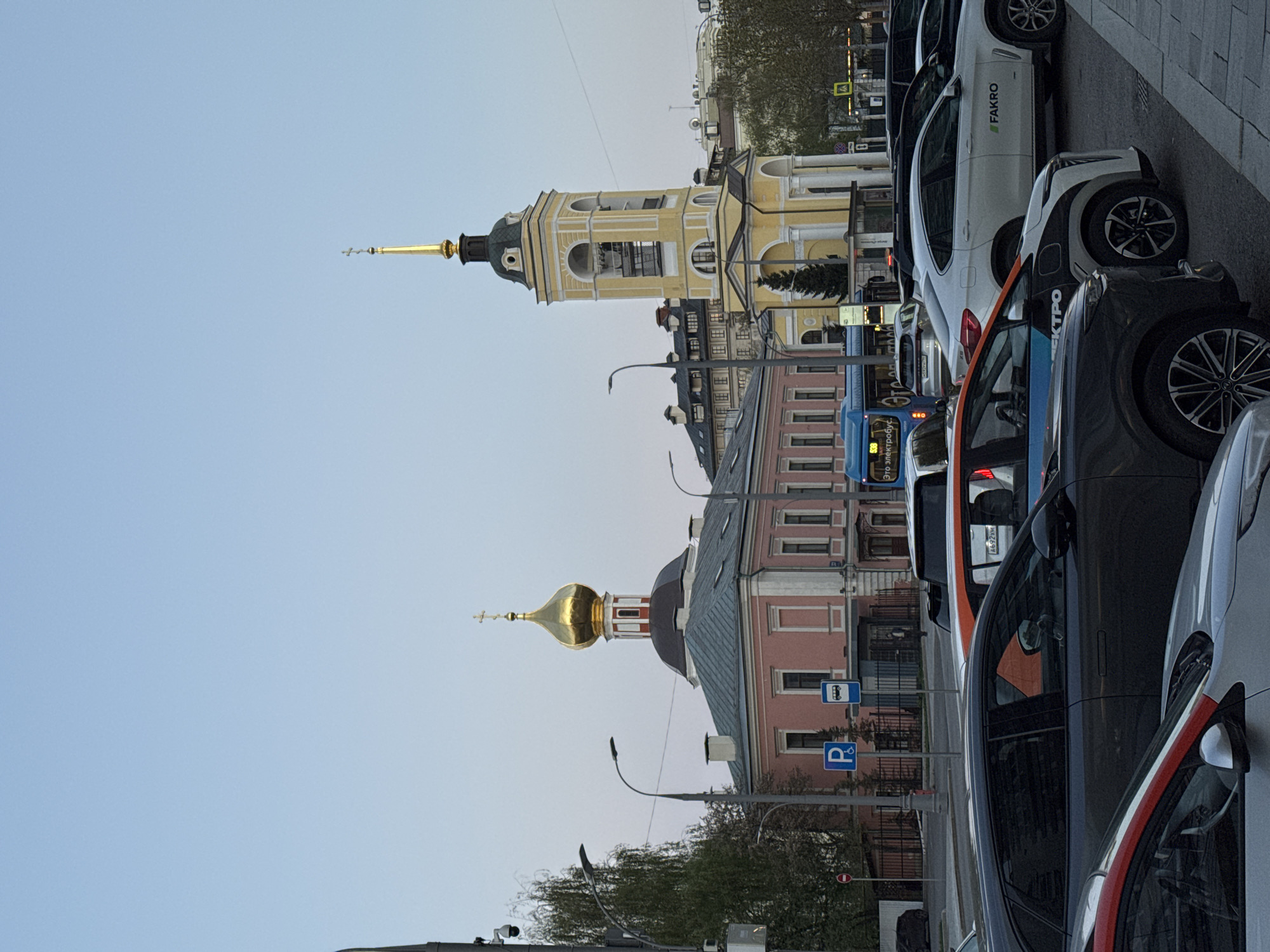 Moscow street scenes documented showing churches, buildings under clear skies