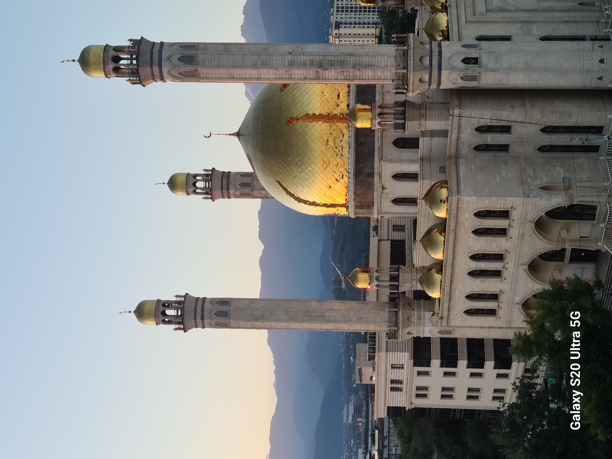 Almaty sunset lights up mosque domes and city skyline