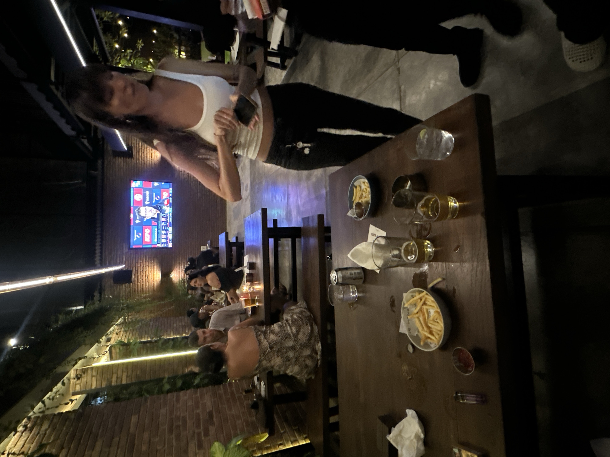 Dancing and pool at a festive outdoor bar night in Kuta Selatan