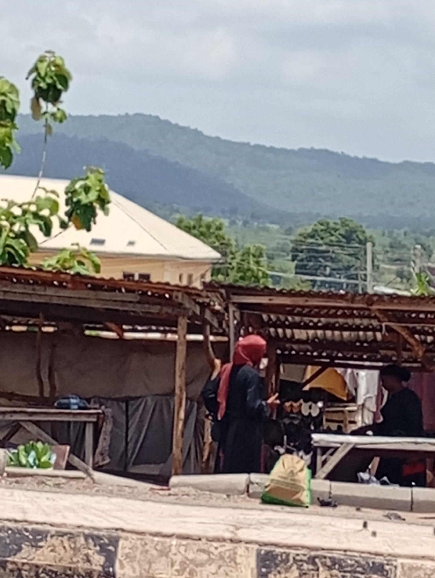 Street life documented in mountainous city during midday