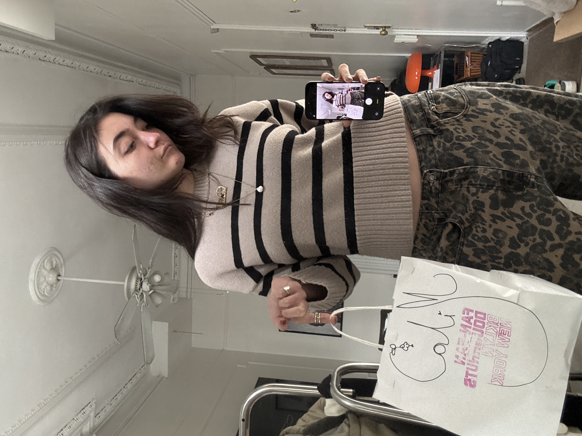 Woman takes shopping selfies in New York indoor location