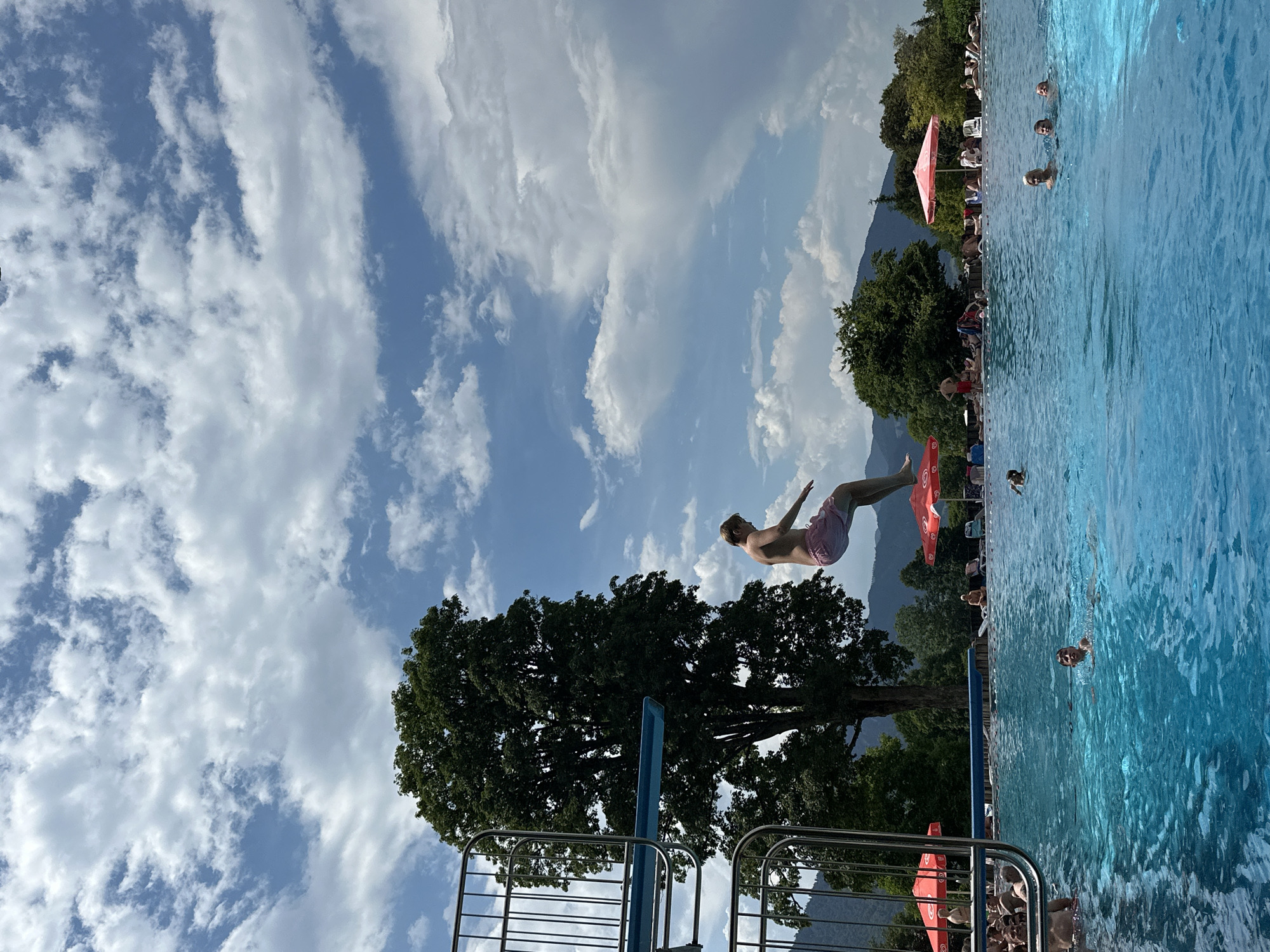 Sunny afternoon at Oberammergau's outdoor pool, dives and all.