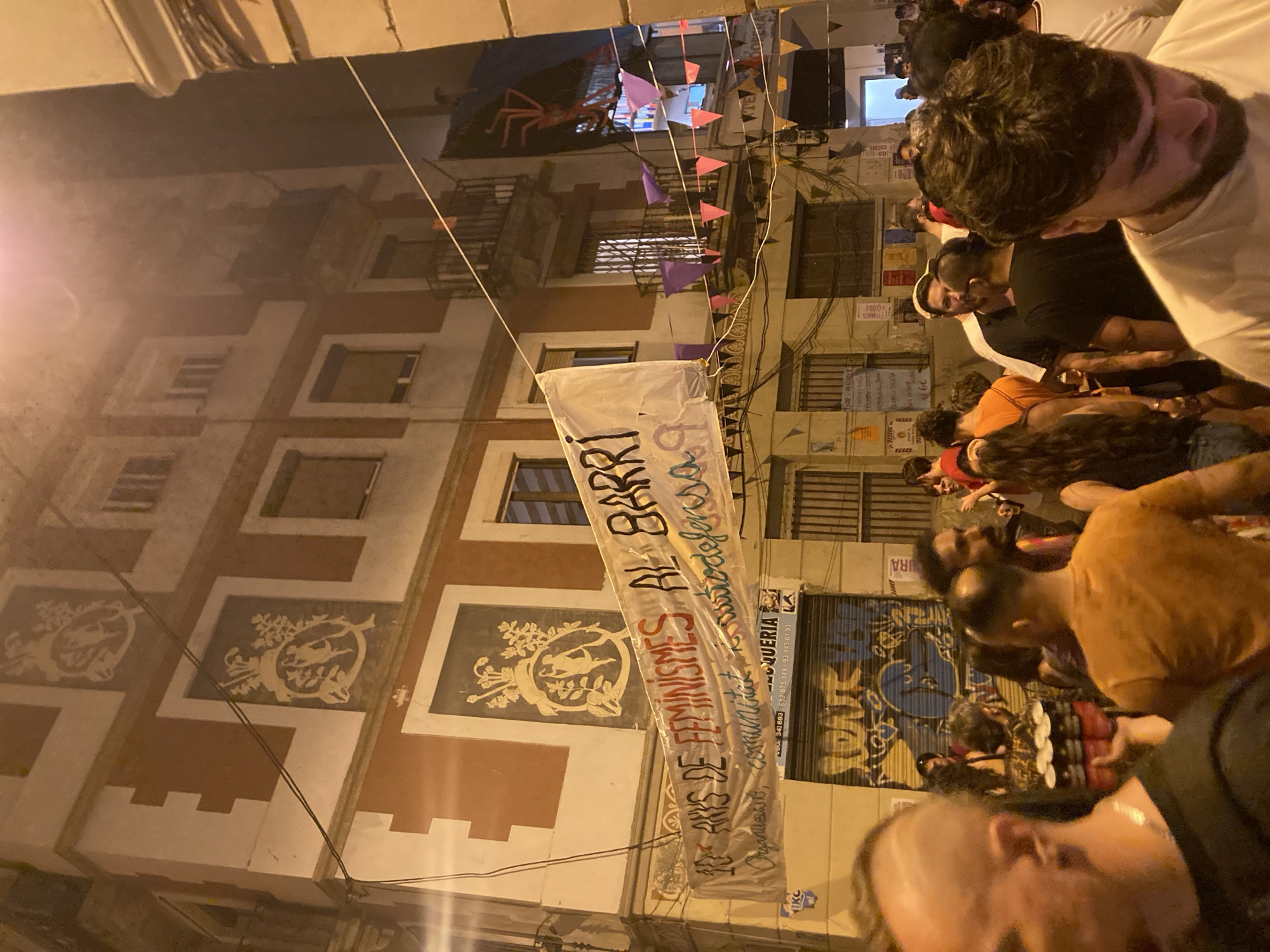 Catalan banner hangs on a Barcelona building at night