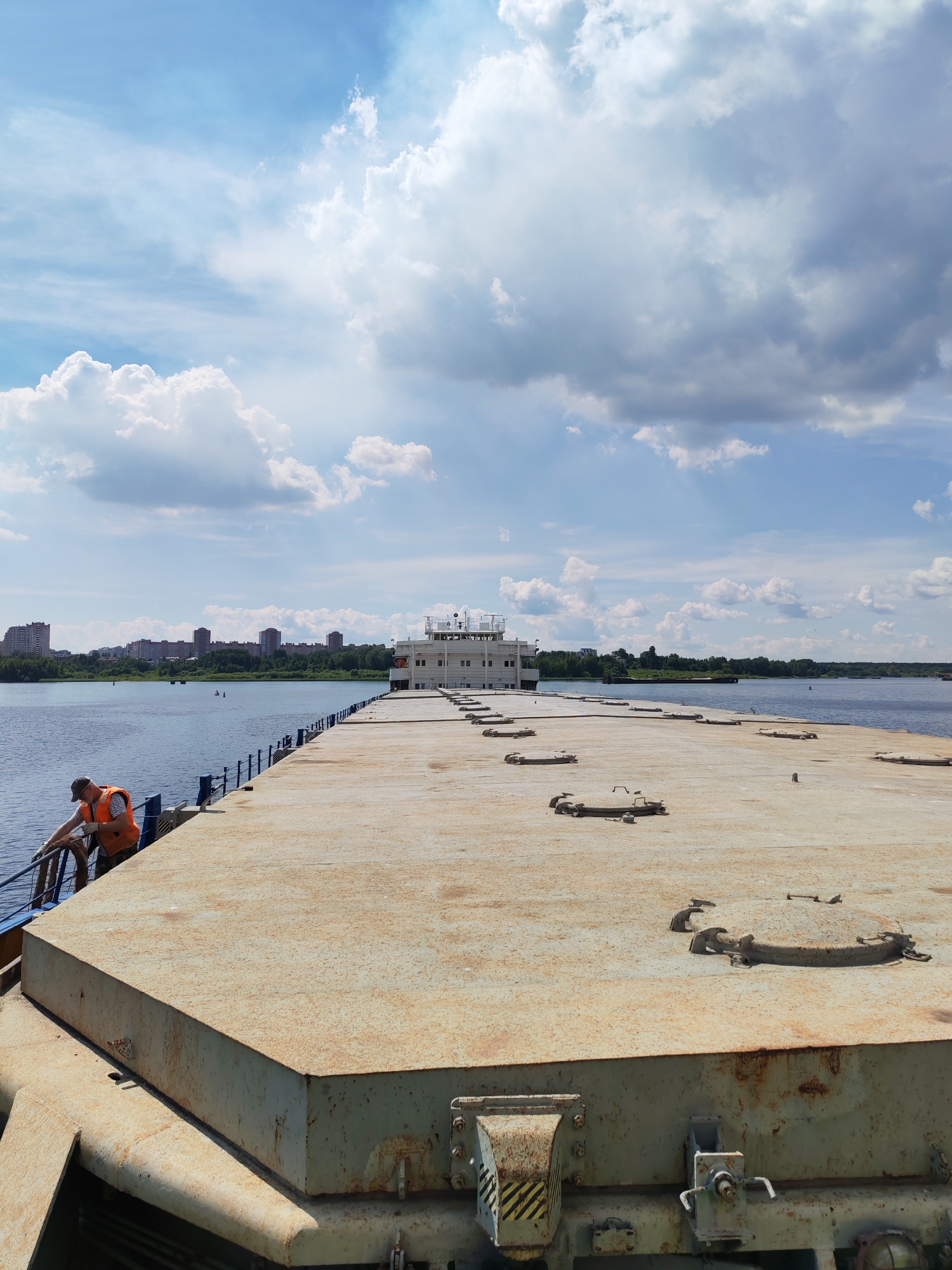 On the water in Cherepovets: port cranes, barges, and river views