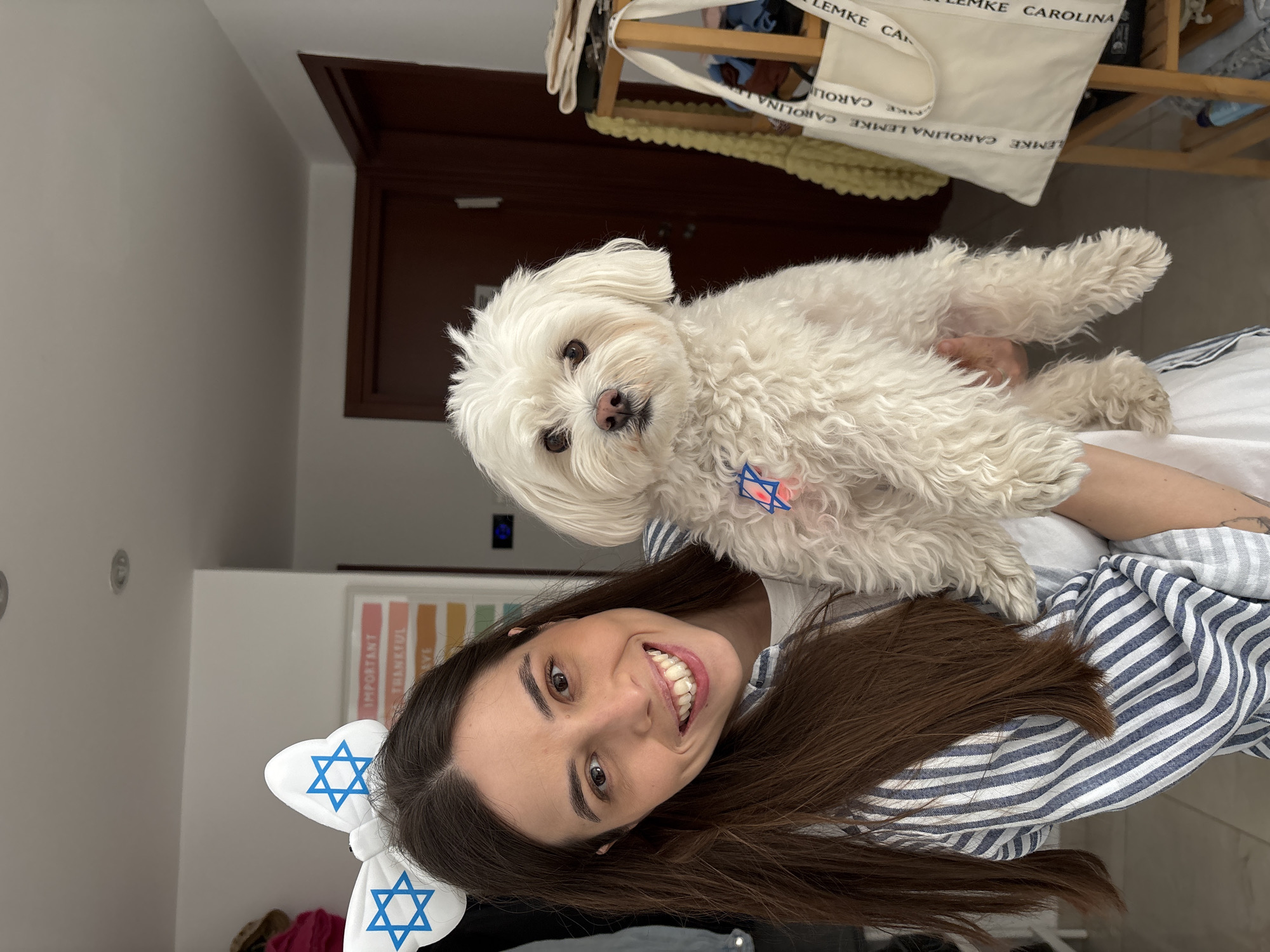 Woman with dog wear Star of David accessories in Bat Yam