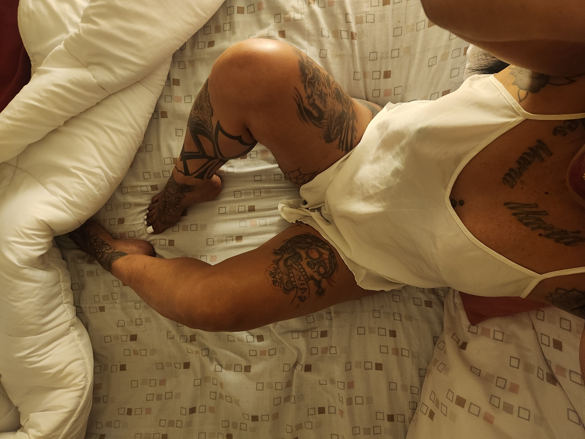 Person rests on patterned bedding in Murcia home