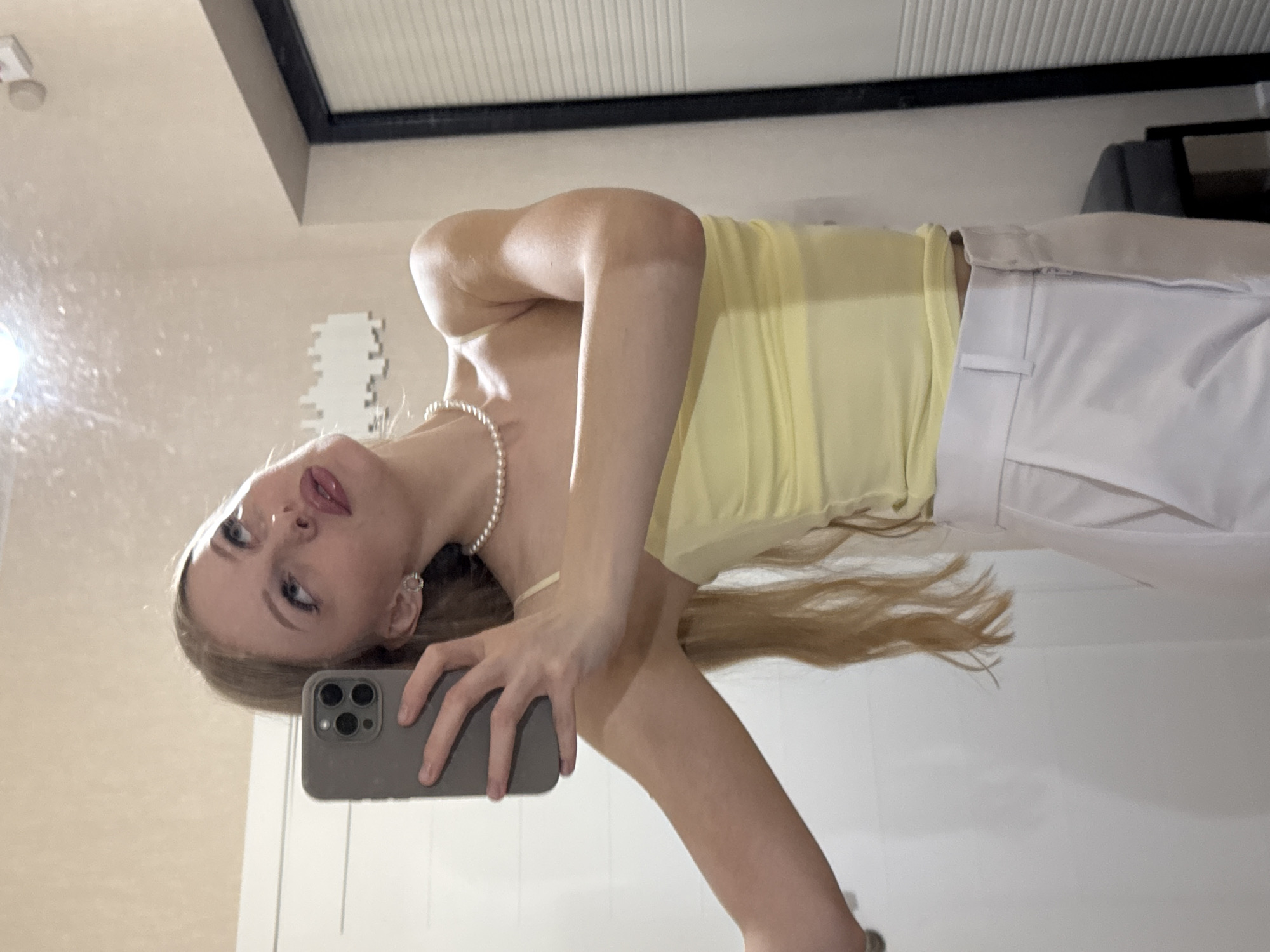 Mirror selfie session in Perm, yellow top and pearls