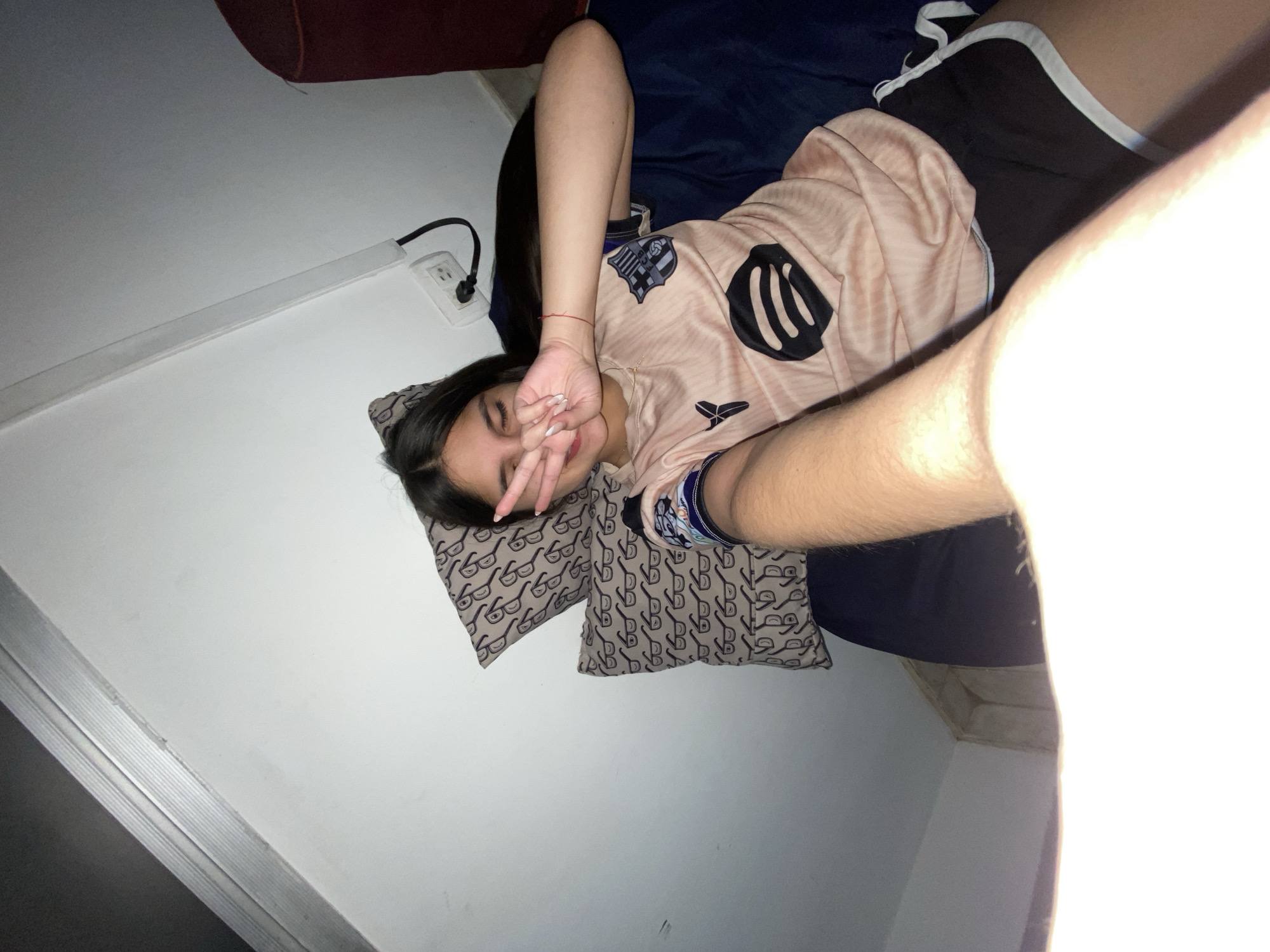 Person resting indoors captured in casual moment in Venezuela