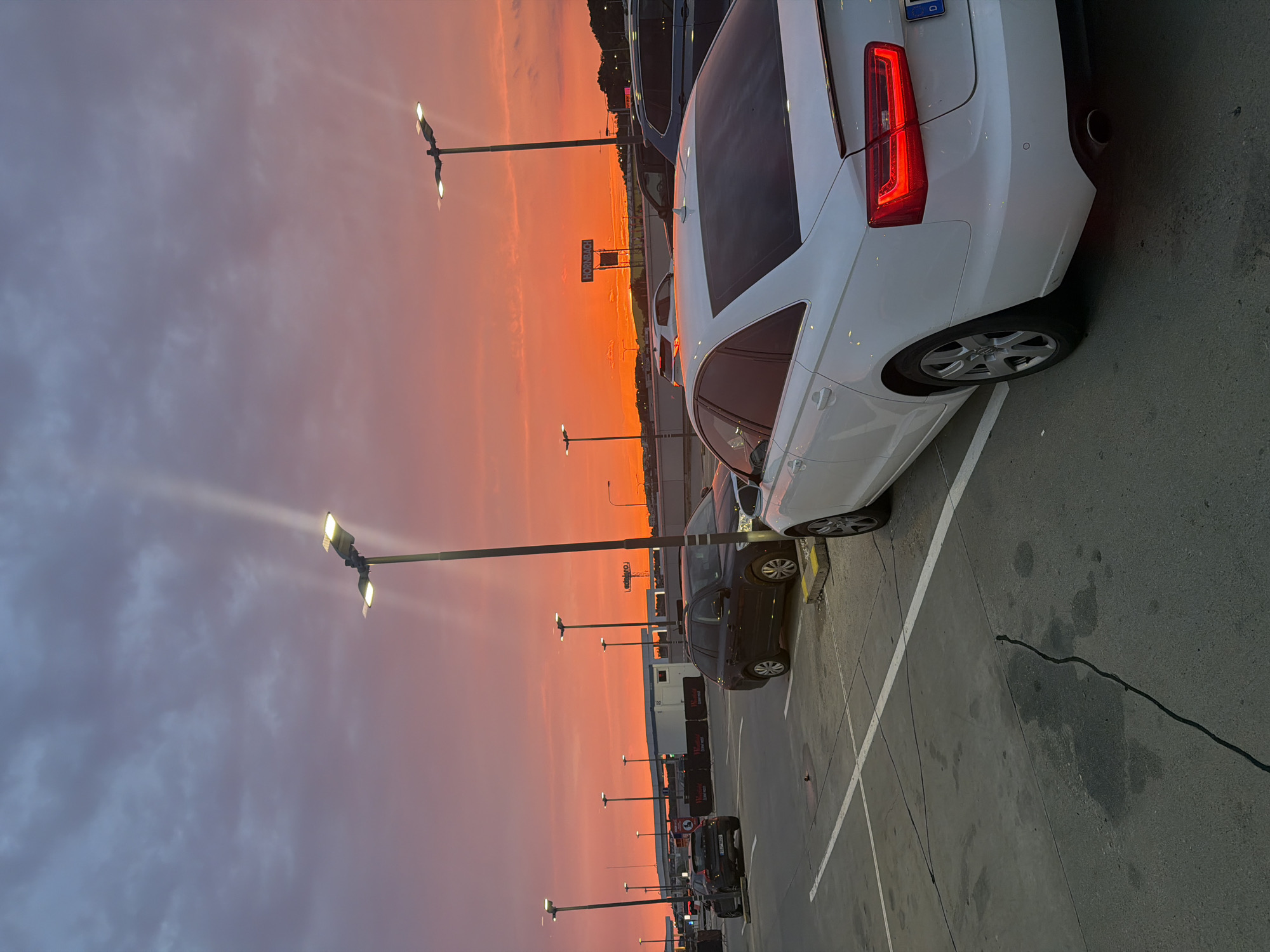 Striking summer sunset over a Prague retail parking lot