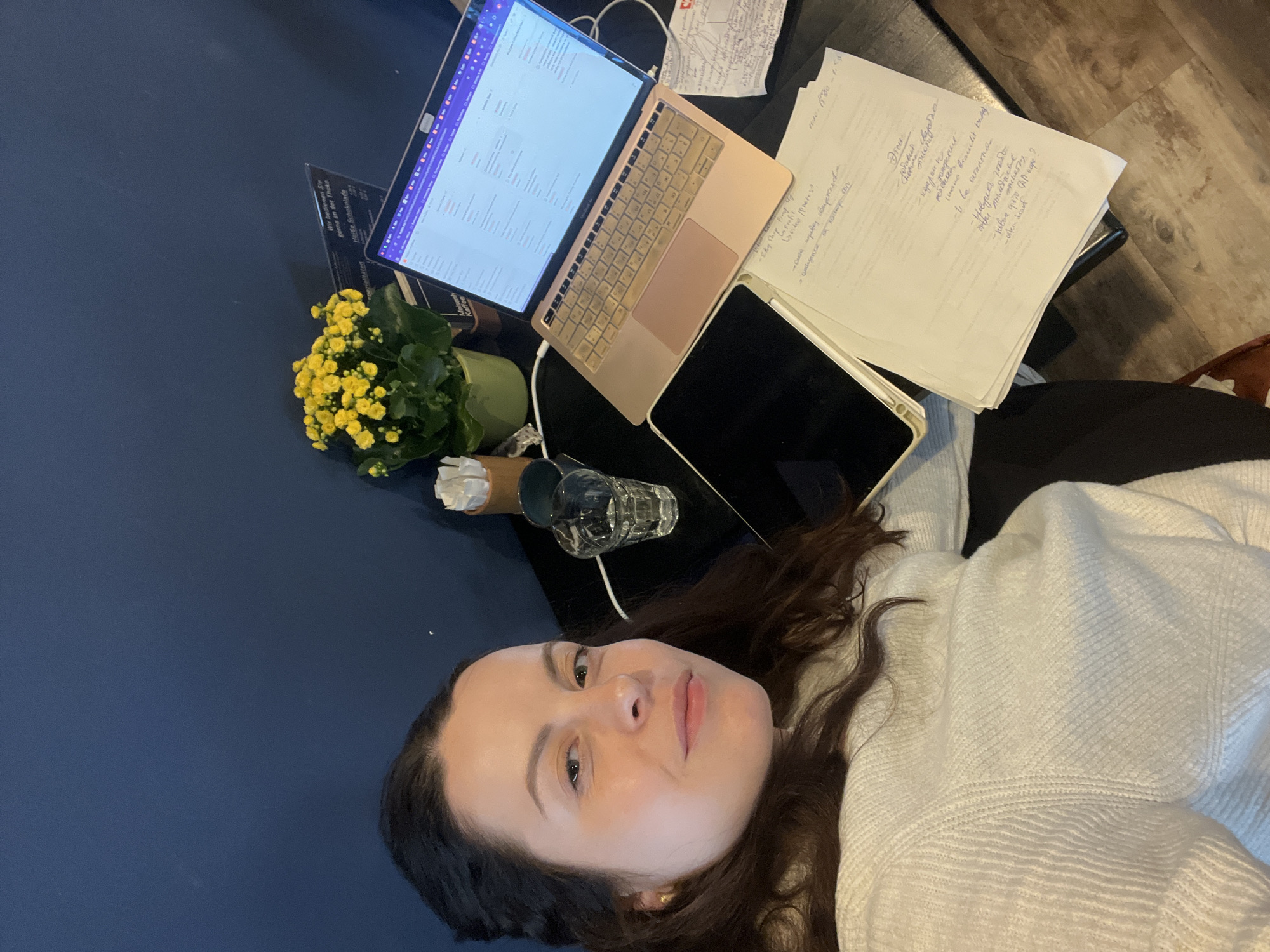 Woman documents morning workspace routine in Meisenheim, Germany