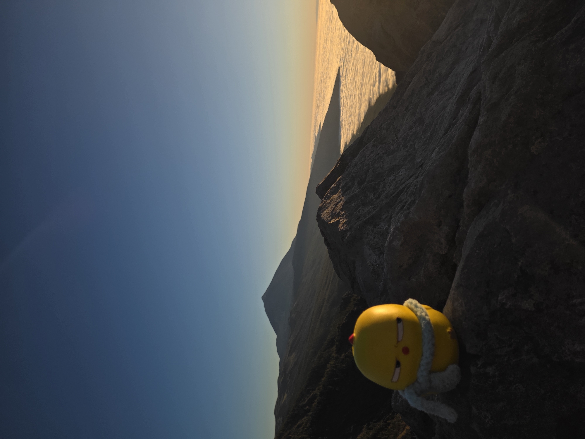 Mountain sunrise viewing with toy mascot in La Orotava