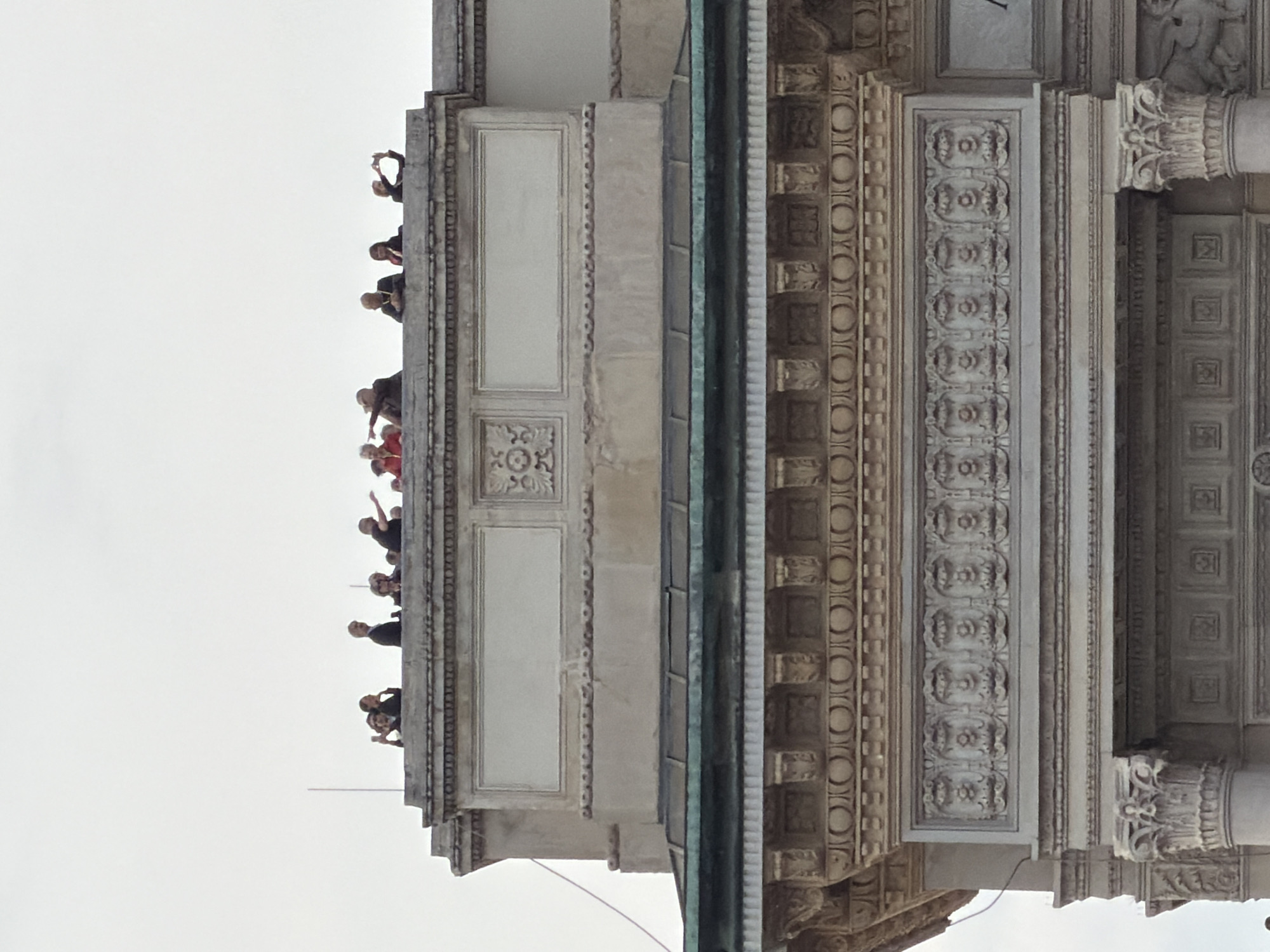 Tourist documents Milan's historic architecture during afternoon visit