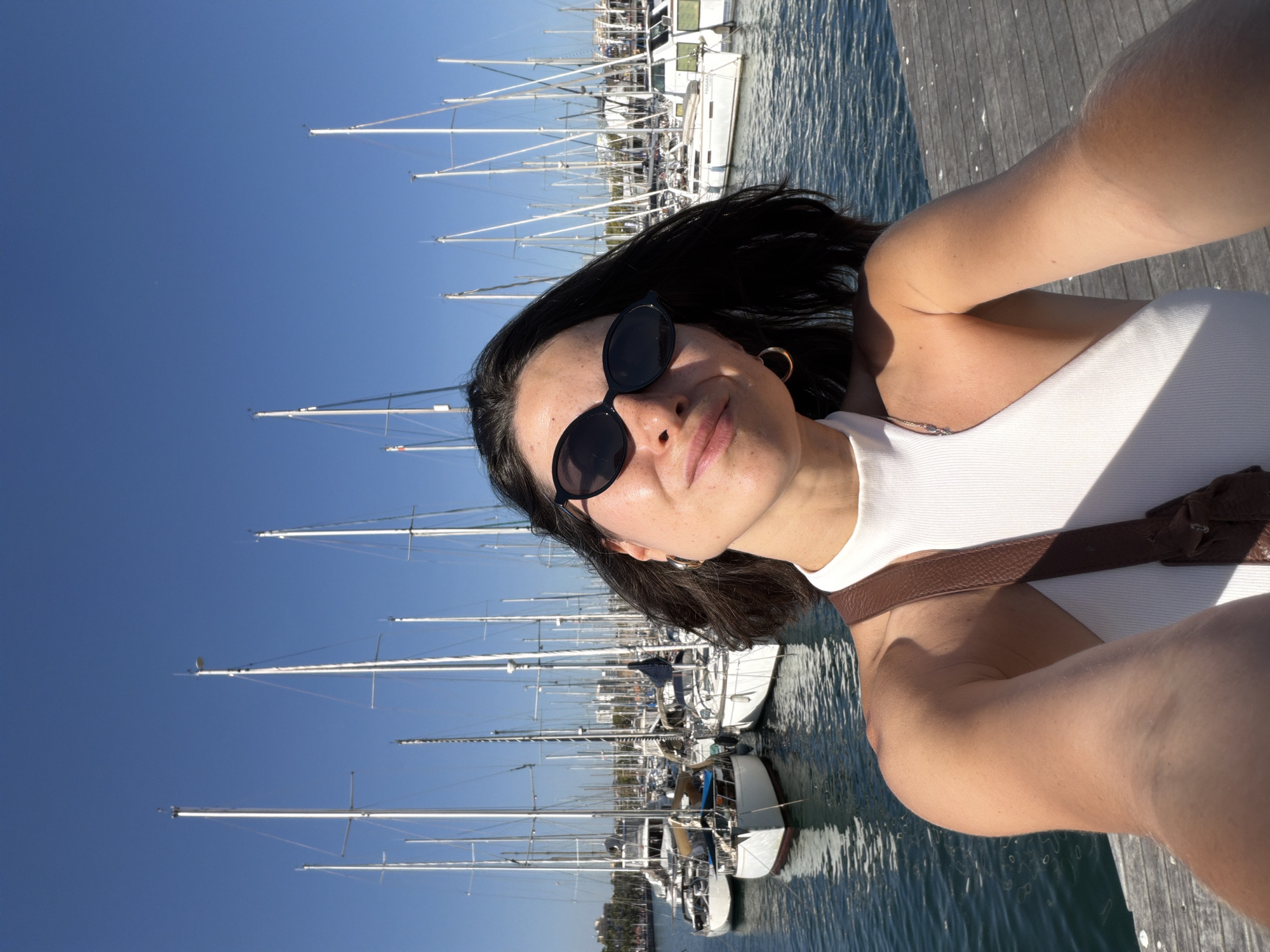 Sunny afternoon brings visitors to Barcelona's marina waterfront