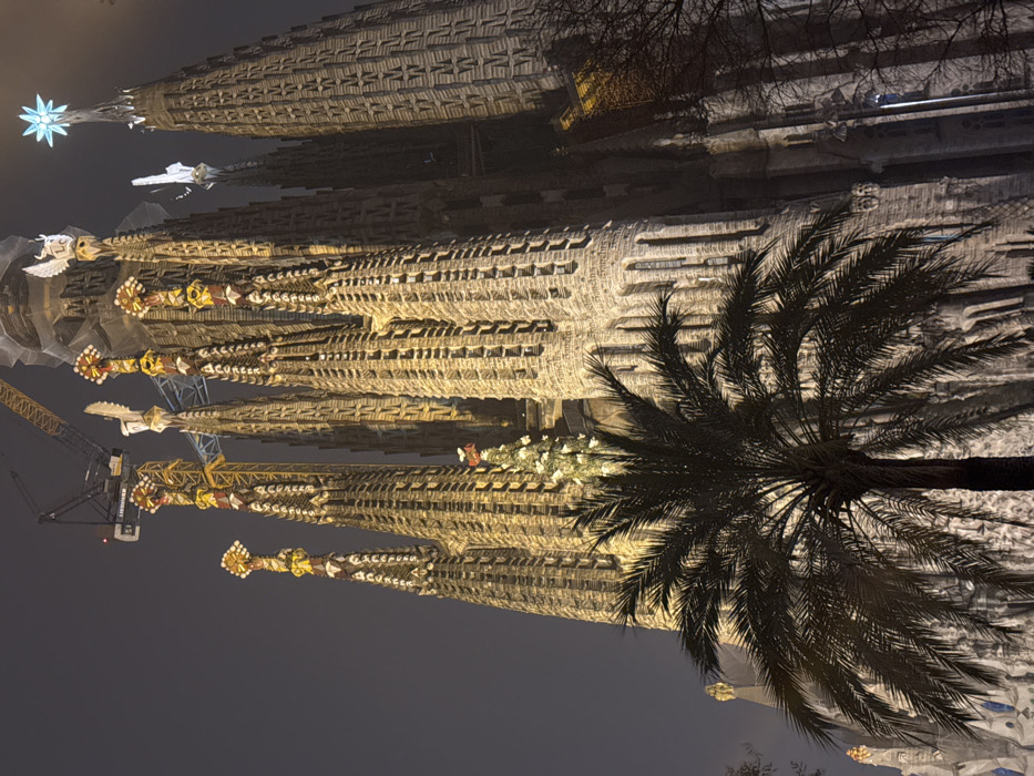 Nighttime views capture illuminated Sagrada Familia in Barcelona