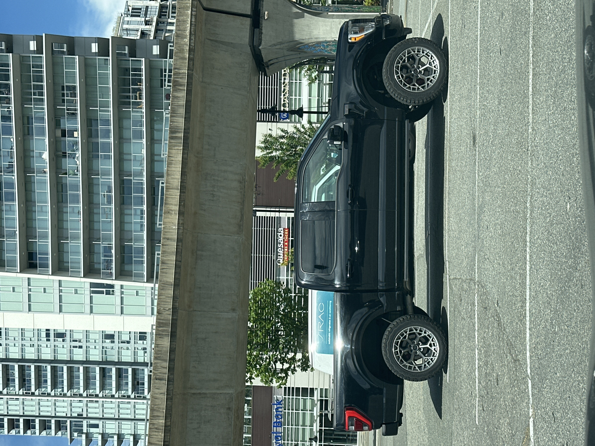 Construction worker operates boom lift at Coquitlam building site